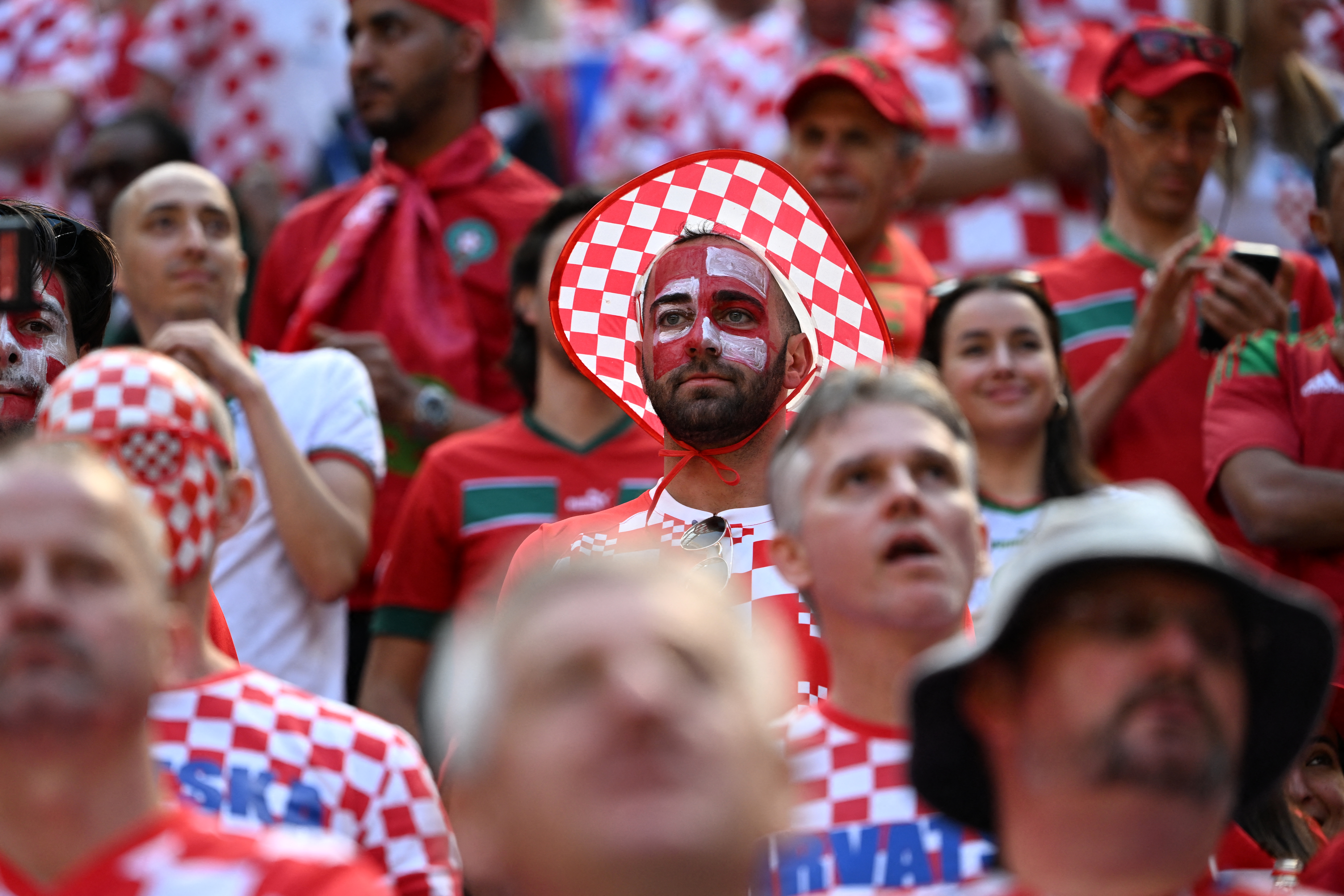 Fans of Croatia wait on the stands ahead of the Qatar 2022 World Cup Group F football match between Morocco and Croatia at the Al-Bayt Stadium in Al Khor, north of Doha on November 23, 2022. (Photo by OZAN KOSE / AFP)