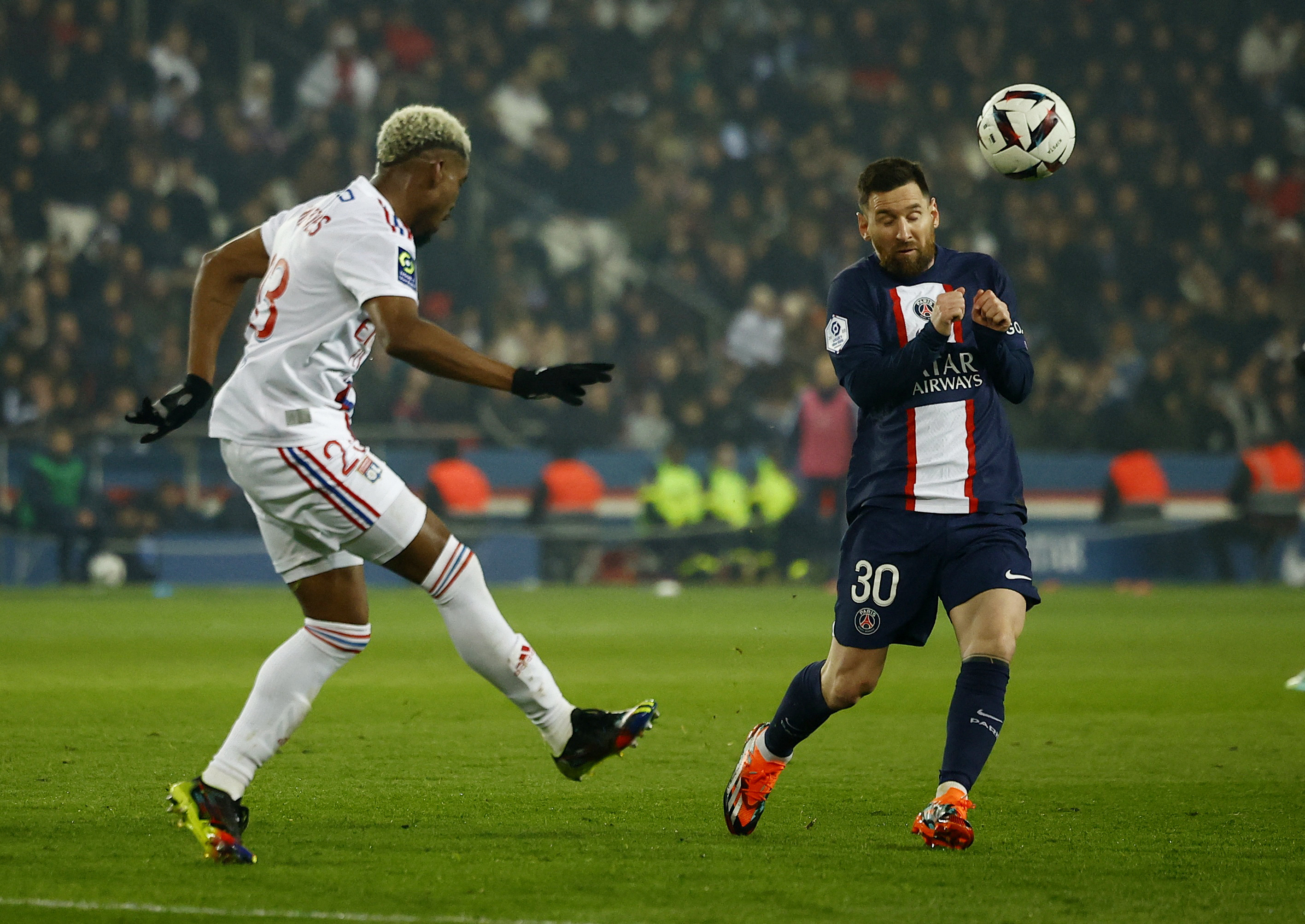 Soccer Football - Ligue 1 - Paris St Germain v Olympique Lyonnais - Parc des Princes, Paris, France - April 2, 2023 Olympique Lyonnais' Thiago Mendes in action with Paris St Germain's Lionel Messi REUTERS/Sarah Meyssonnier