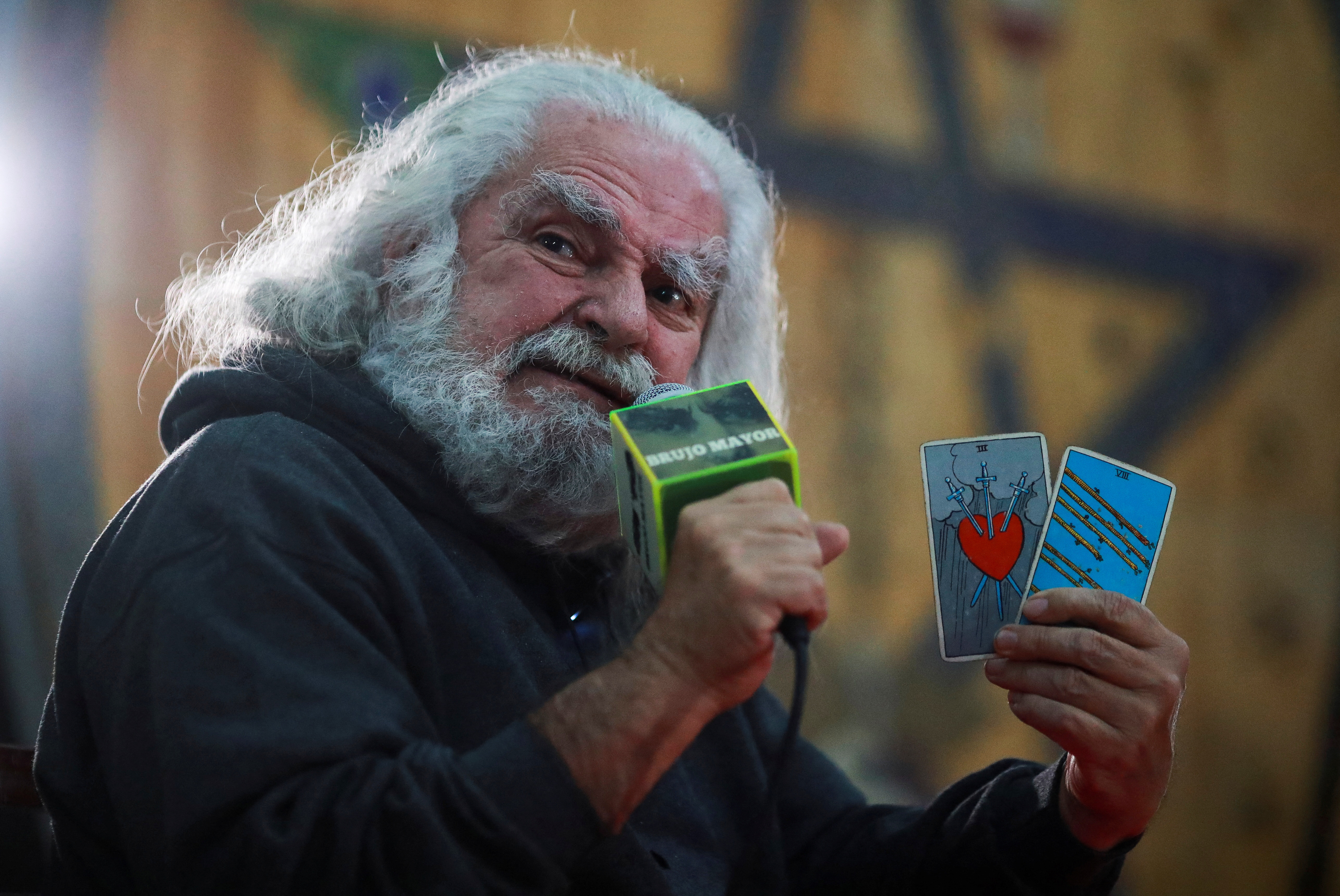 Antonio Vazquez Alba "Senior Warlock"also known as Mexico's Grand Warlock, holds tarot cards during a ceremony to make his predictions for the year 2023, in Mexico City, Mexico January 3, 2023. REUTERS/Henry Romero
