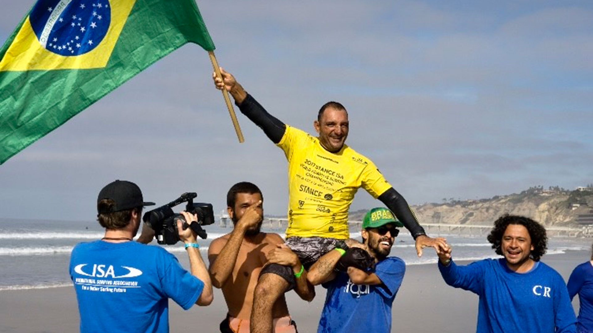 Brazilian Adaptive surfing pioneer Alcino Neto celebrates a gold medal at the 2017 Adaptive Surfing World Championships (ISA)