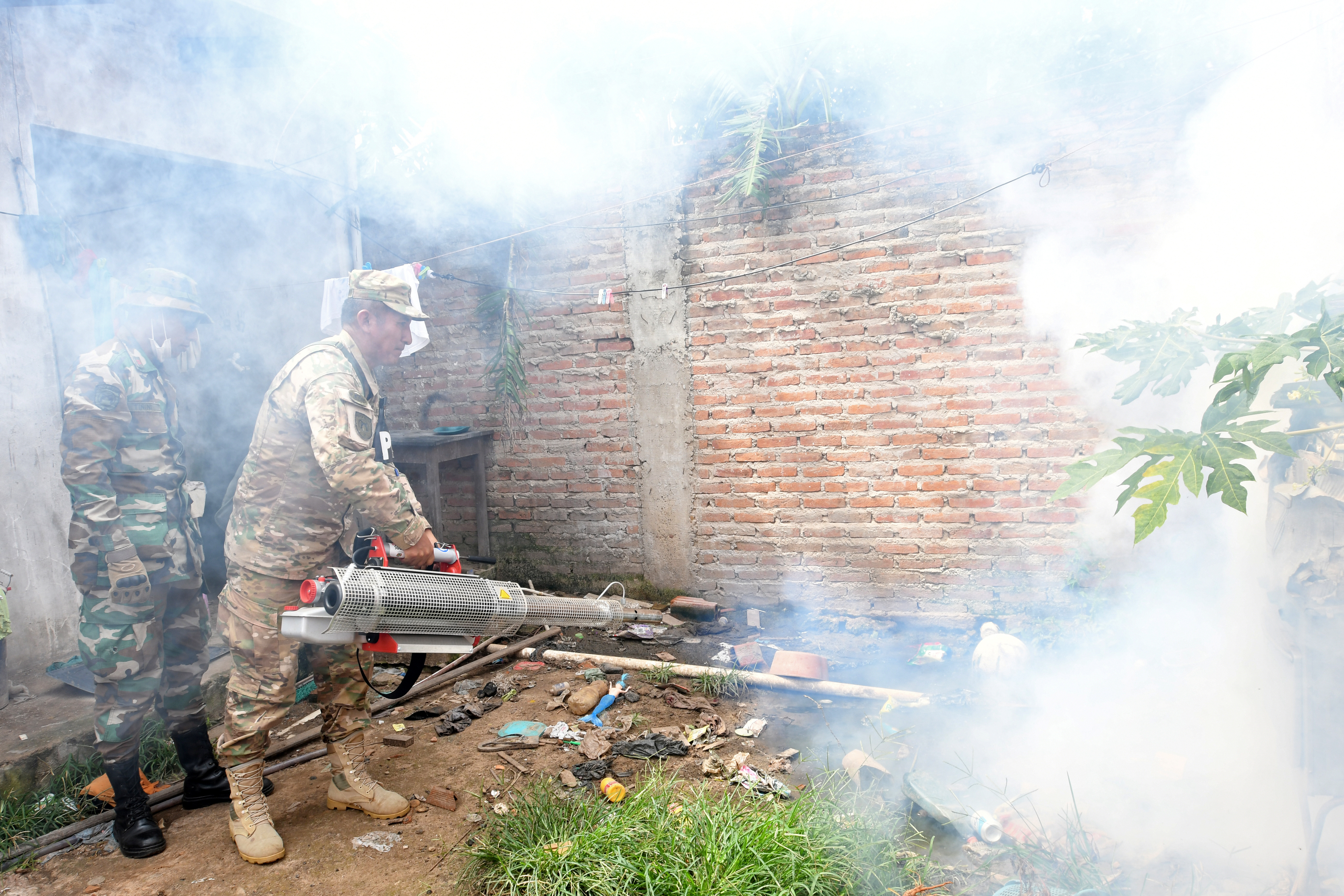 A Bolivian soldier fumigates a slum to prevent dengue at the Plan 3000 district in Santa Cruz, Bolivia, February 2, 2020. REUTERS/Rodrigo Urzagasti