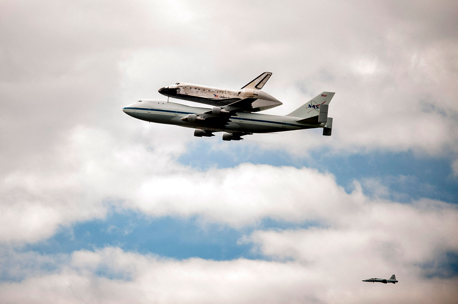 In this file photo taken on April 17, 2012, the space shuttle Discovery docks to the rear of NASA 905 Shuttle Carrier Aircraft (SCA), a modified Boeing 747 jumbo jet, during a flyby of the nation's capital on its voyage. final to his place of retirement in Washington, DC.  Pete Marovich / GETTY IMAGES NORTH AMERICA / AFP