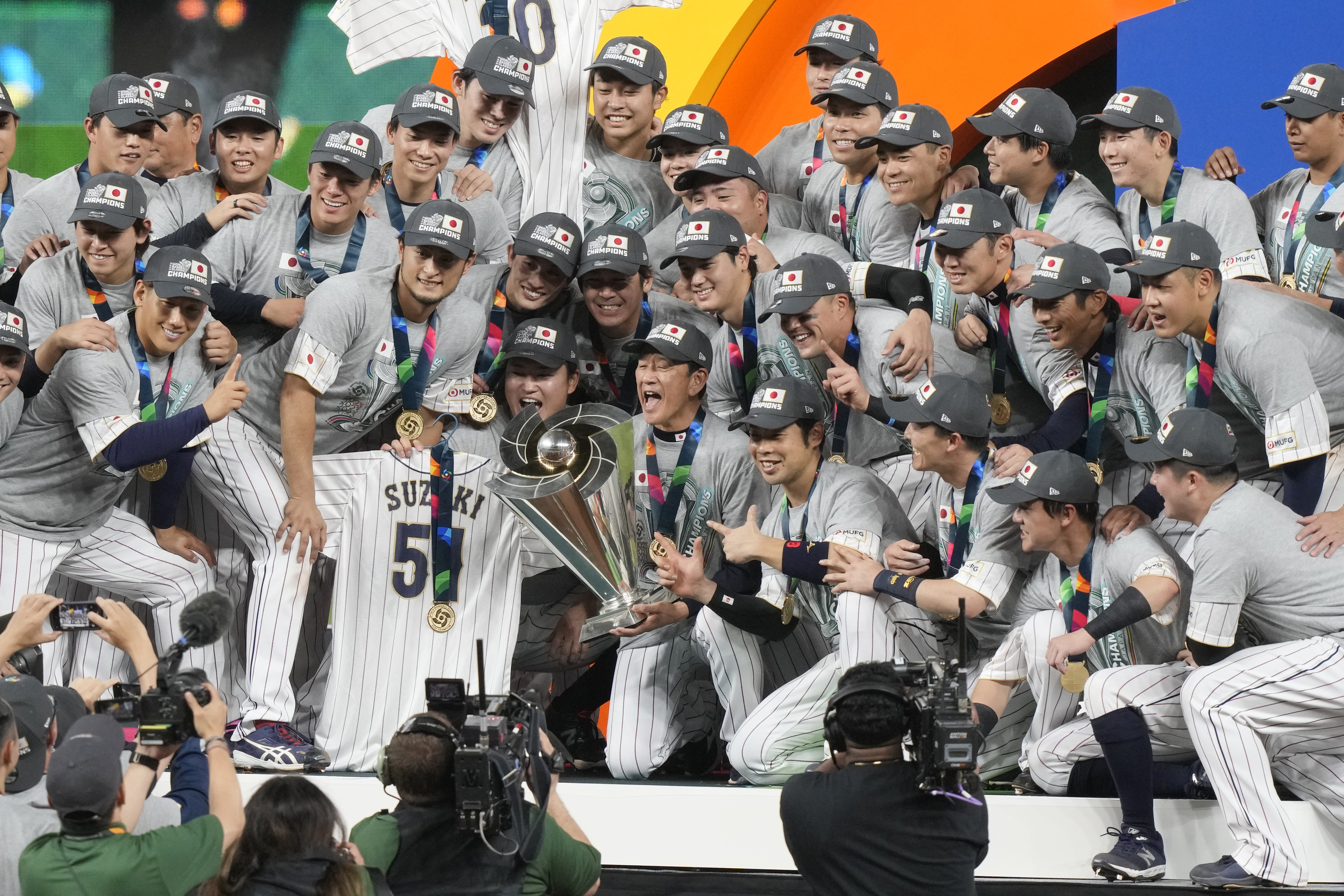 Players from Japan celebrate after being crowned champions of the World Baseball Classic, Tuesday, March 21, 2023, in Miami.  Japan defeated the United States 3-2 in the final.  (AP Photo/Marta Lavandier)