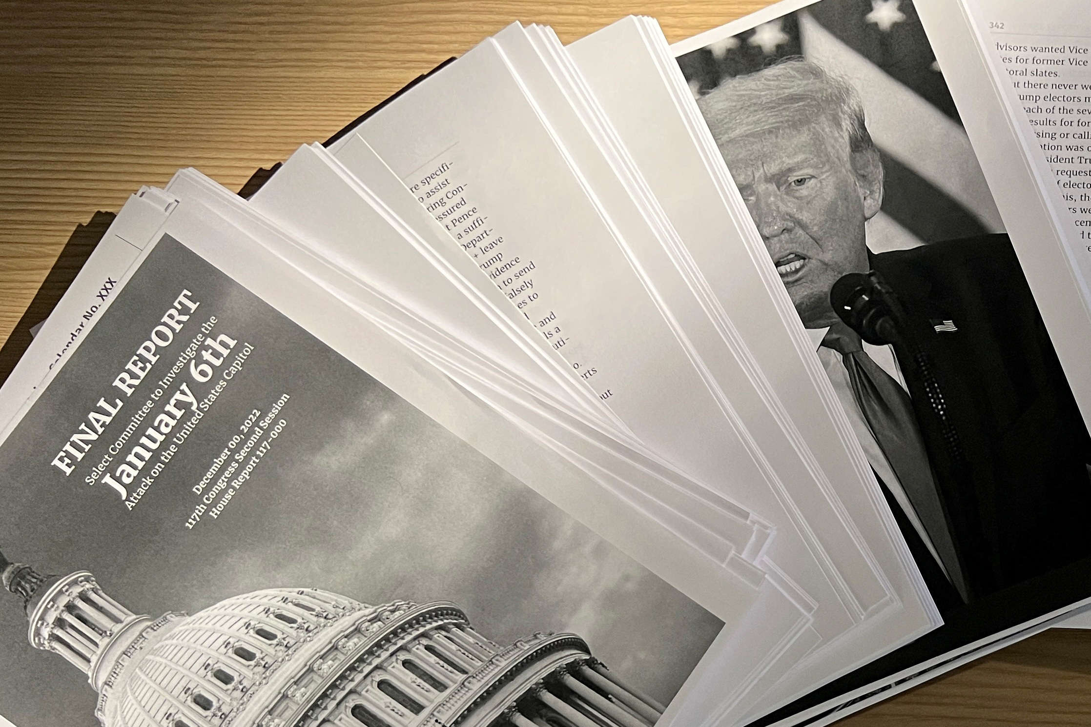 A copy of the final report printed by the congressional committee that held the hearing on January 1.  An attack on the U.S. capital Jan. 6, 2021, as former U.S. President Donald Trump outlines his case to face criminal charges for inciting deadly riots, is seen in a briefing photo in Washington, U.S., Dec. 23, 2022. (REUTERS/Julio-Cesar Chavez) #