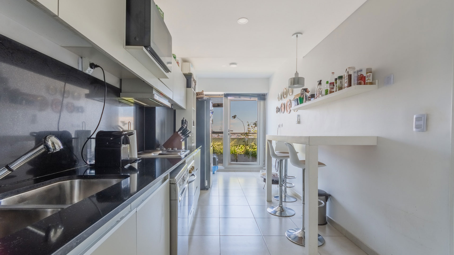 The kitchen is long and is connected to the laundry room.  Currently there are not many triplexes for sale in Buenos Aires