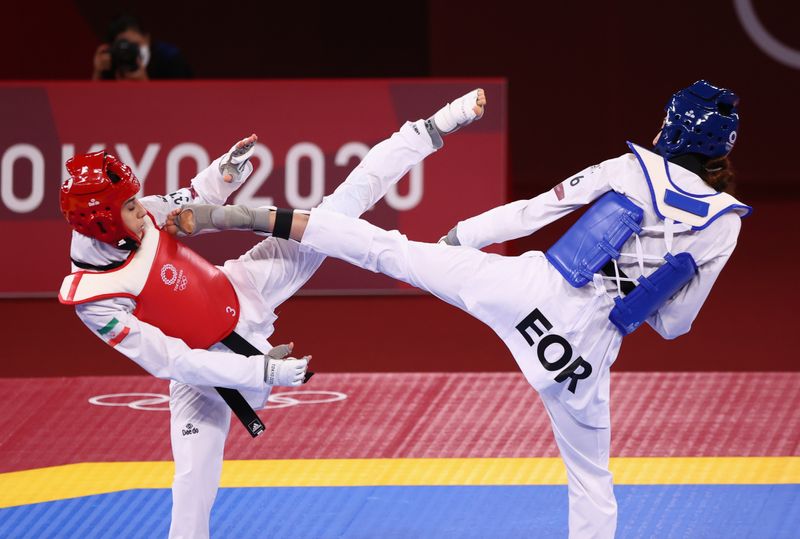 Jul 25, 2021. 
Illustrative photo of Kimia Alizadeh, from the Olympic refugee team, against the Iranian Nahid Kiyanichandeh in the women's taekwondo event up to 57 kilos. 

REUTERS/Murad Sezer