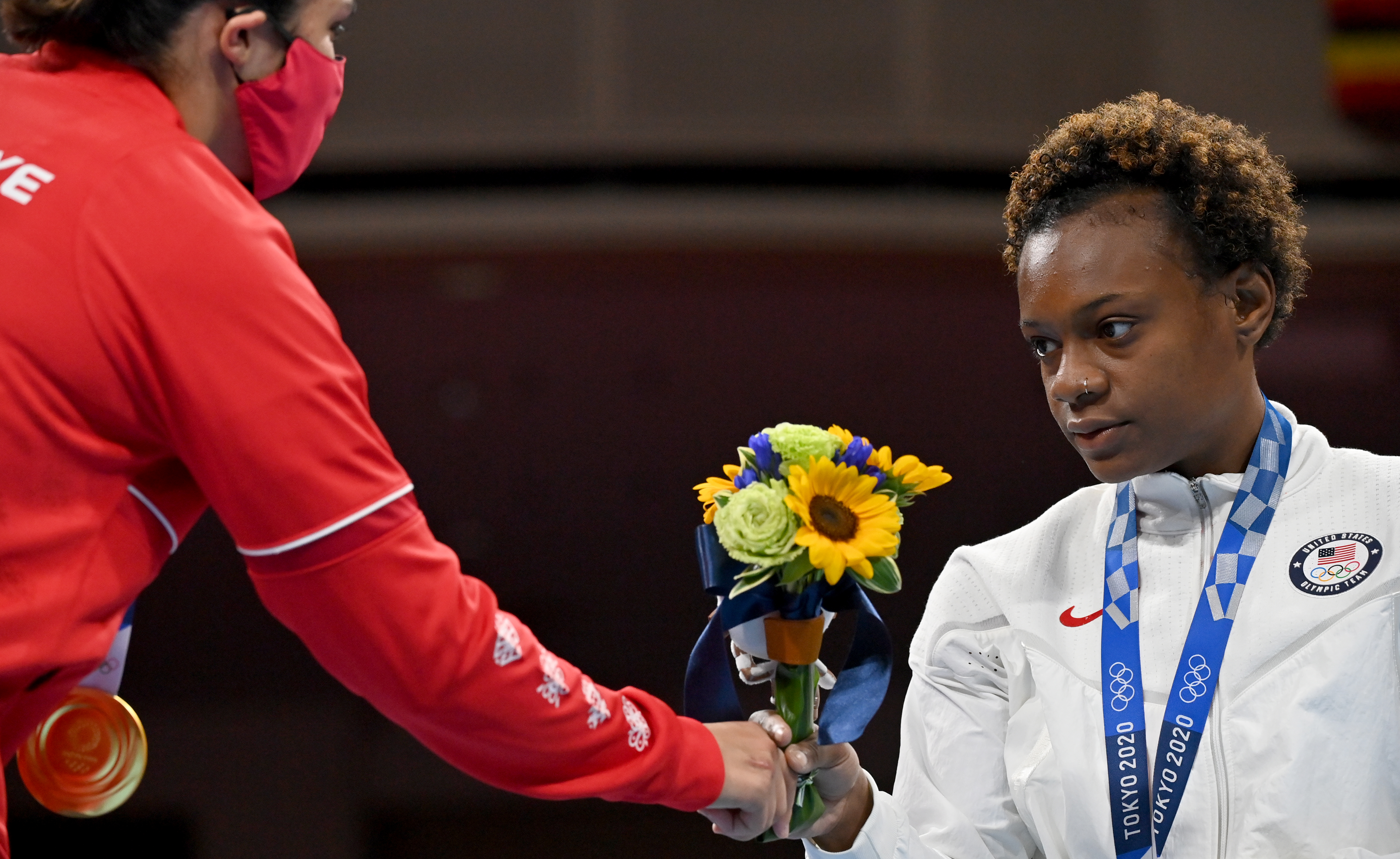 Tokyo 2020 Olympics - Boxing - Women's Welterweight - Medal Ceremony - Kokugikan Arena - Tokyo, Japan - August 7, 2021. Bronze medallist Oshae Jones of the United States receives flowers  during the medal ceremony. Pool via REUTERS/Luis Robayo
