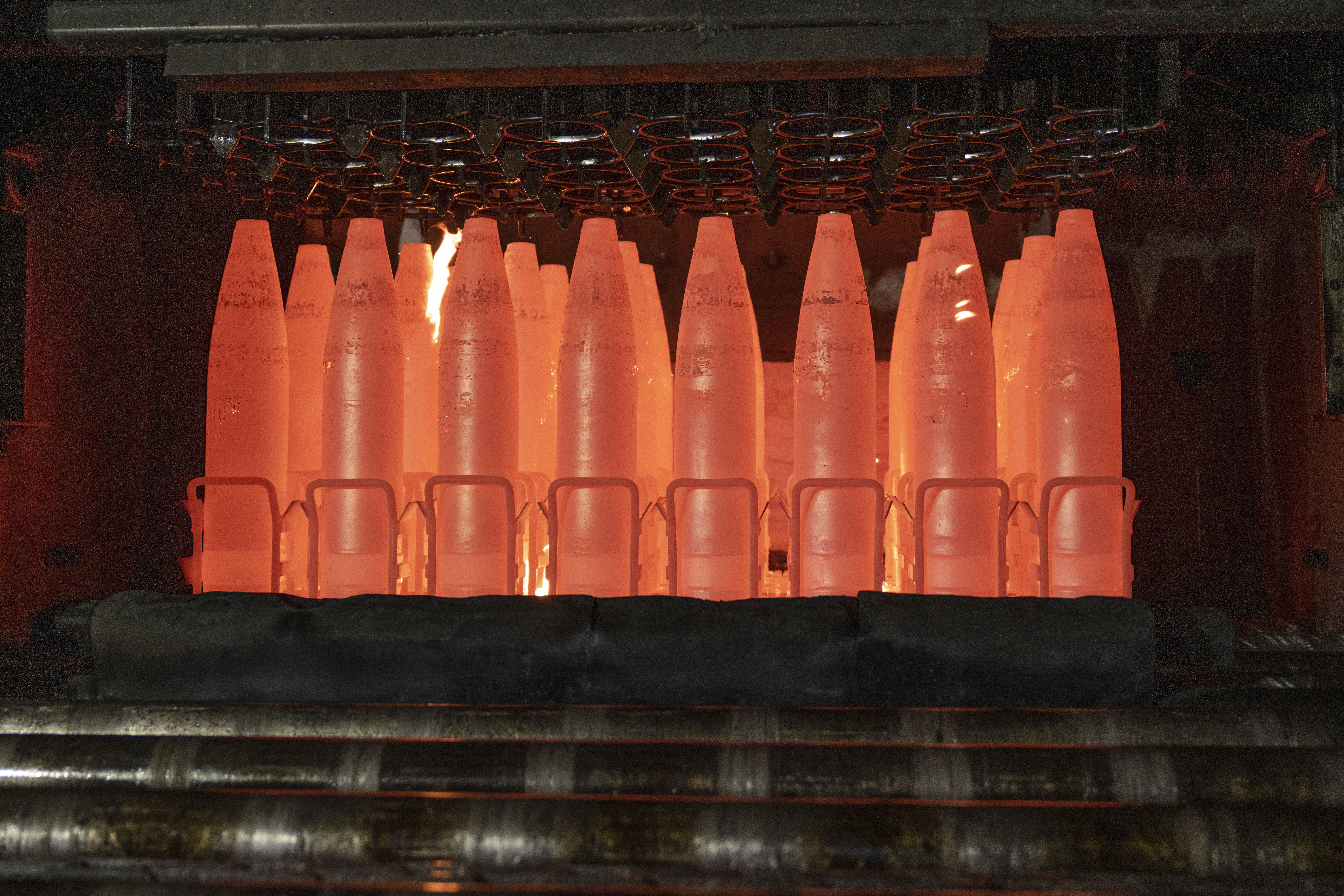 The 155mm cartridge is a very large bullet, made up of four parts: the primer, the projectile, the propellant, and the primer.  (AP Photo/Matt Rourke)

