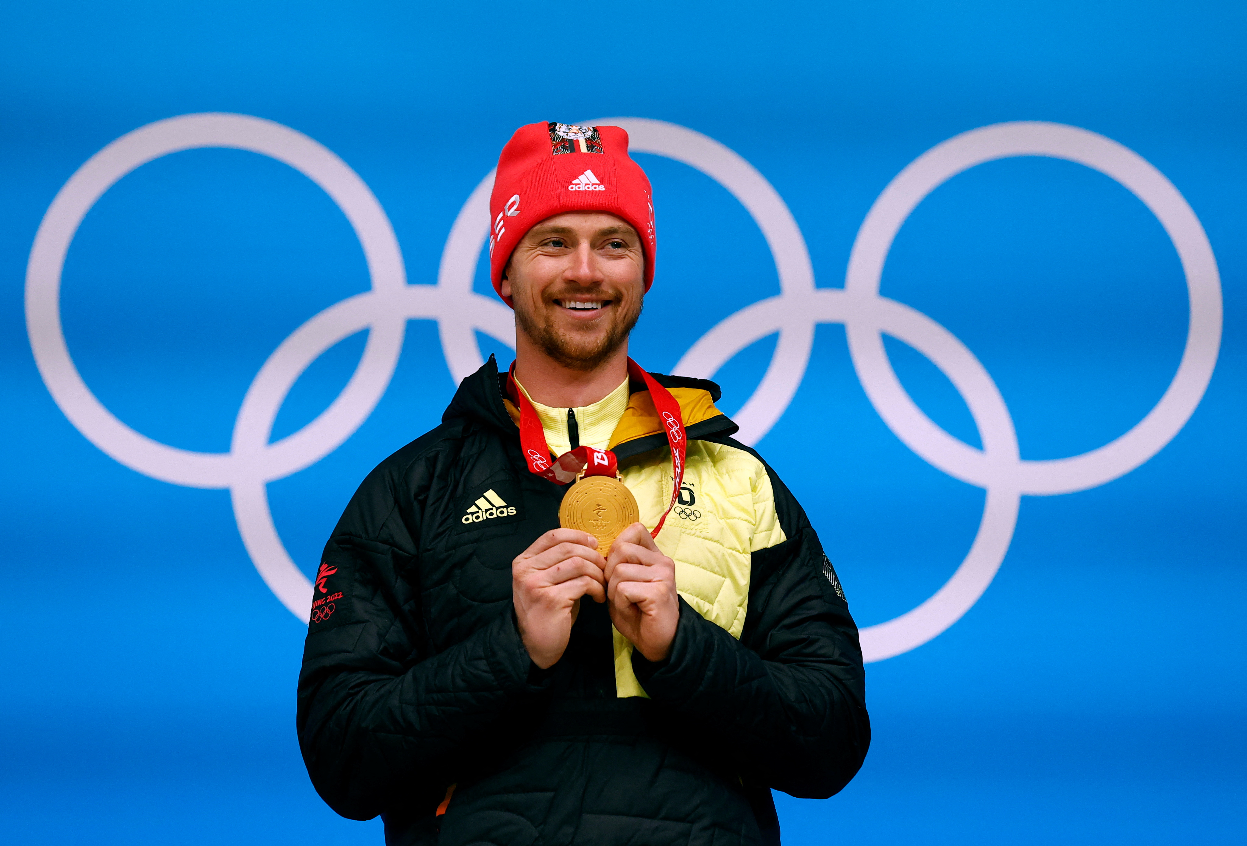 FILE PHOTO: 2022 Beijing Olympics - Victory Ceremony - Luge - Men - National Sliding Centre, Beijing, China - February 6, 2022. Johannes Ludwig of Germany poses with his gold medal after winning. REUTERS/Thomas Peter/File Photo