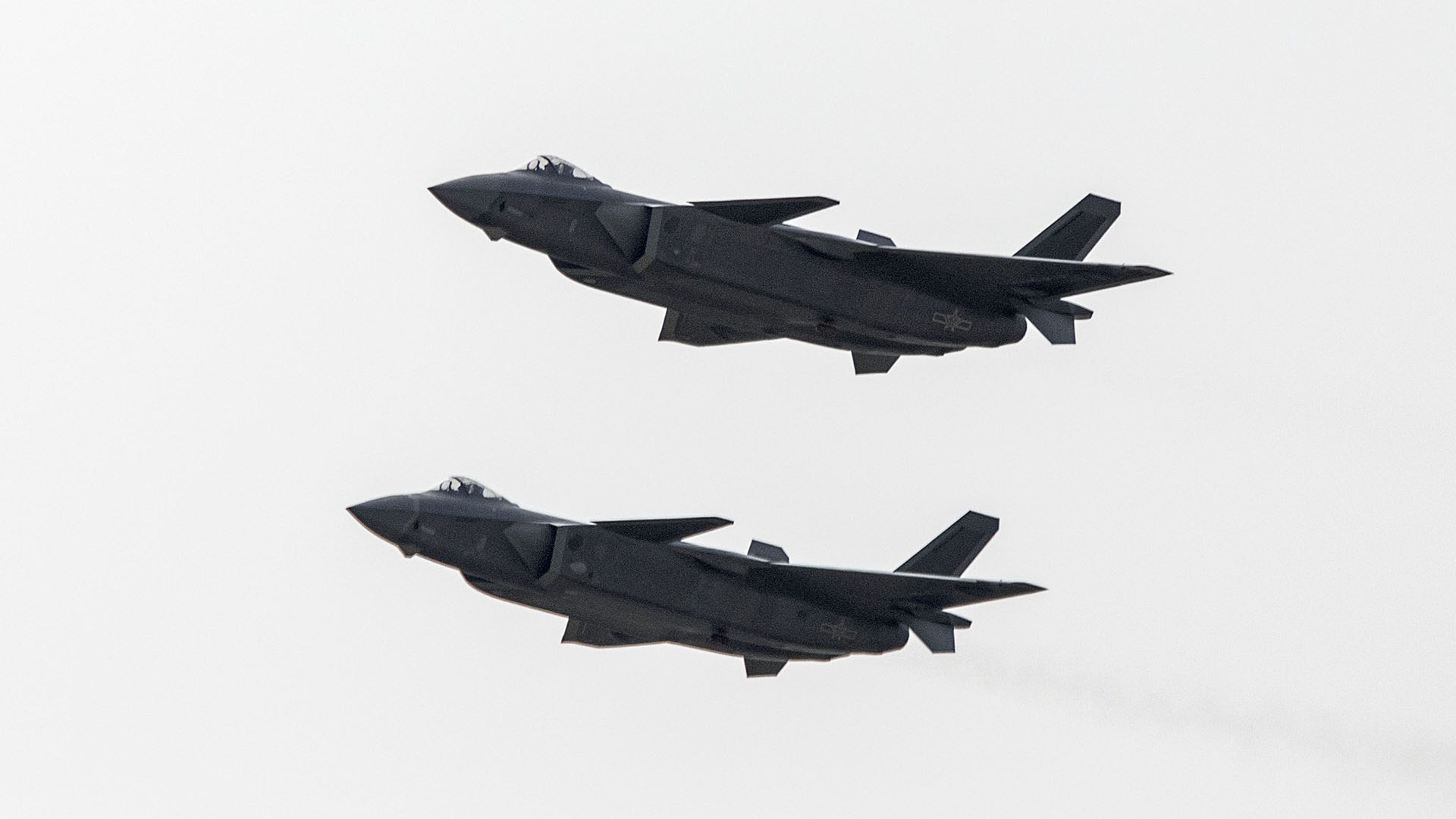 Dos aviones de la Fuerza Aérea Popular de Liberación de China (Qilai Shen/Bloomberg)
