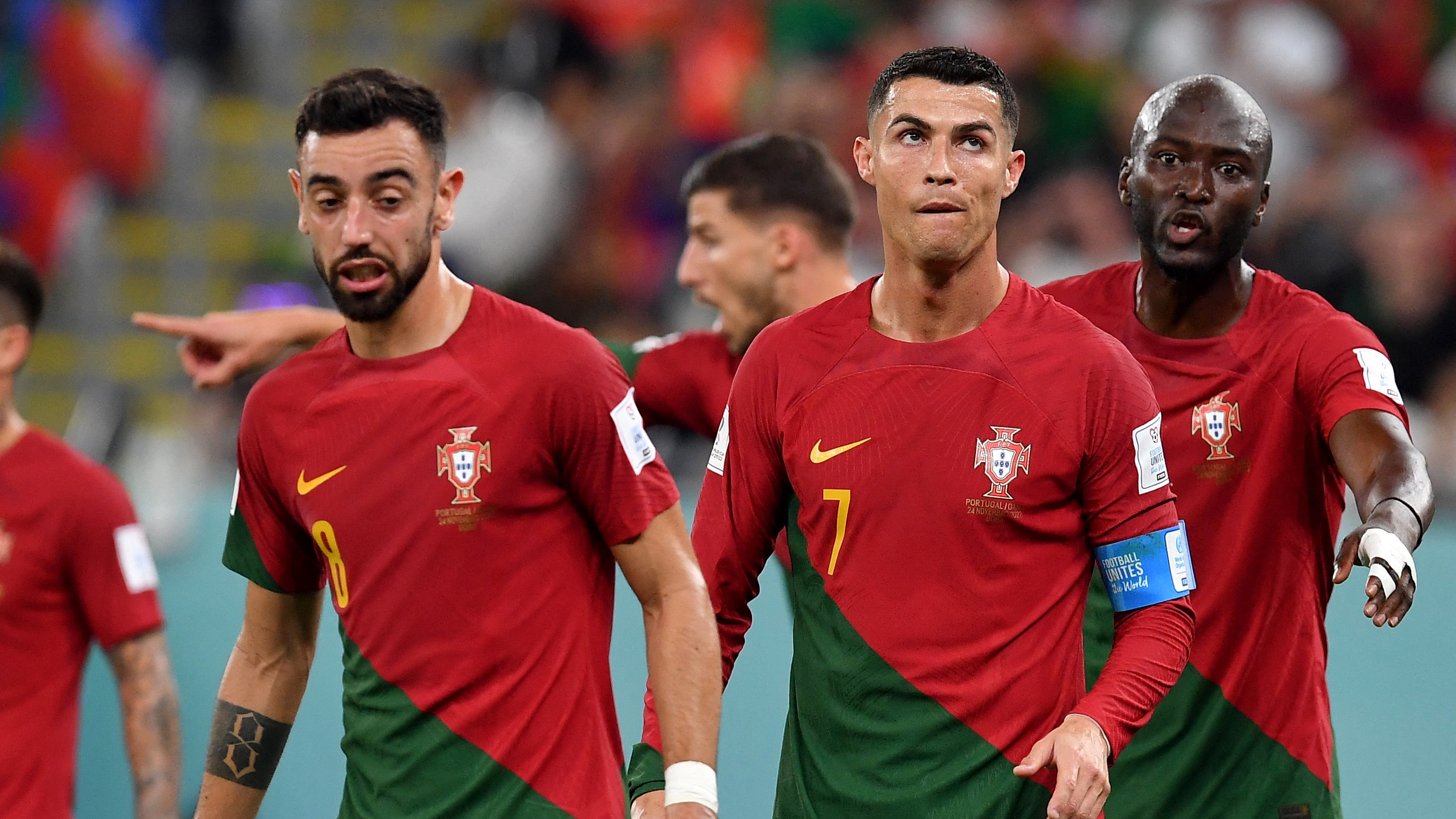 Soccer Football - FIFA World Cup Qatar 2022 - Group H - Portugal v Ghana - Stadium 974, Doha, Qatar - November 24, 2022 Portugal's Bruno Fernandes, Cristiano Ronaldo and Danilo Pereira REUTERS/Jennifer Lorenzini