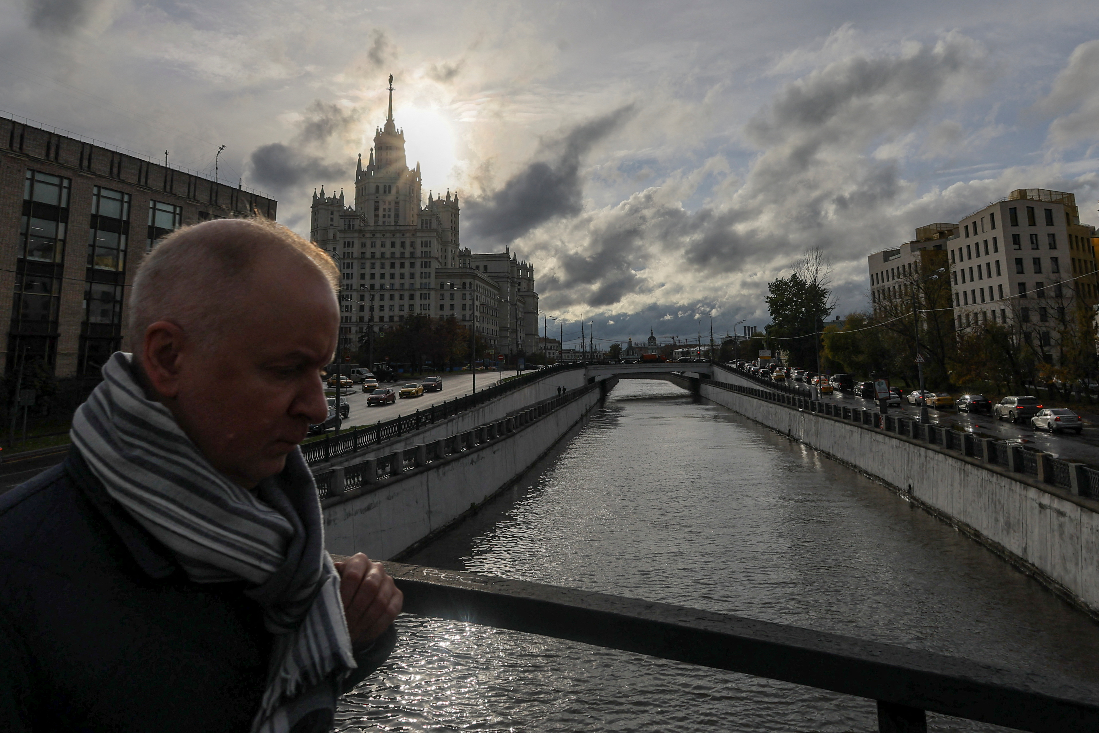 A man walks across a bridge in Moscow on October 4, 2022.  (REUTERS/Evgenia Novozhenina)