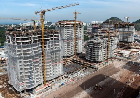 General view of the construction site of the Athletes' village for the Olympic park for the Rio 2016 Olympic and Paralympic games at Barra da Tijuca in Rio de Janeiro, Brazil, on June 28, 2014. The Athletes' village will continue to develop as a luxury housing project called "Ilha Pura" after the Games. AFP PHOTO / YASUYOSHI CHIBA        (Photo credit should read YASUYOSHI CHIBA/AFP/Getty Images)