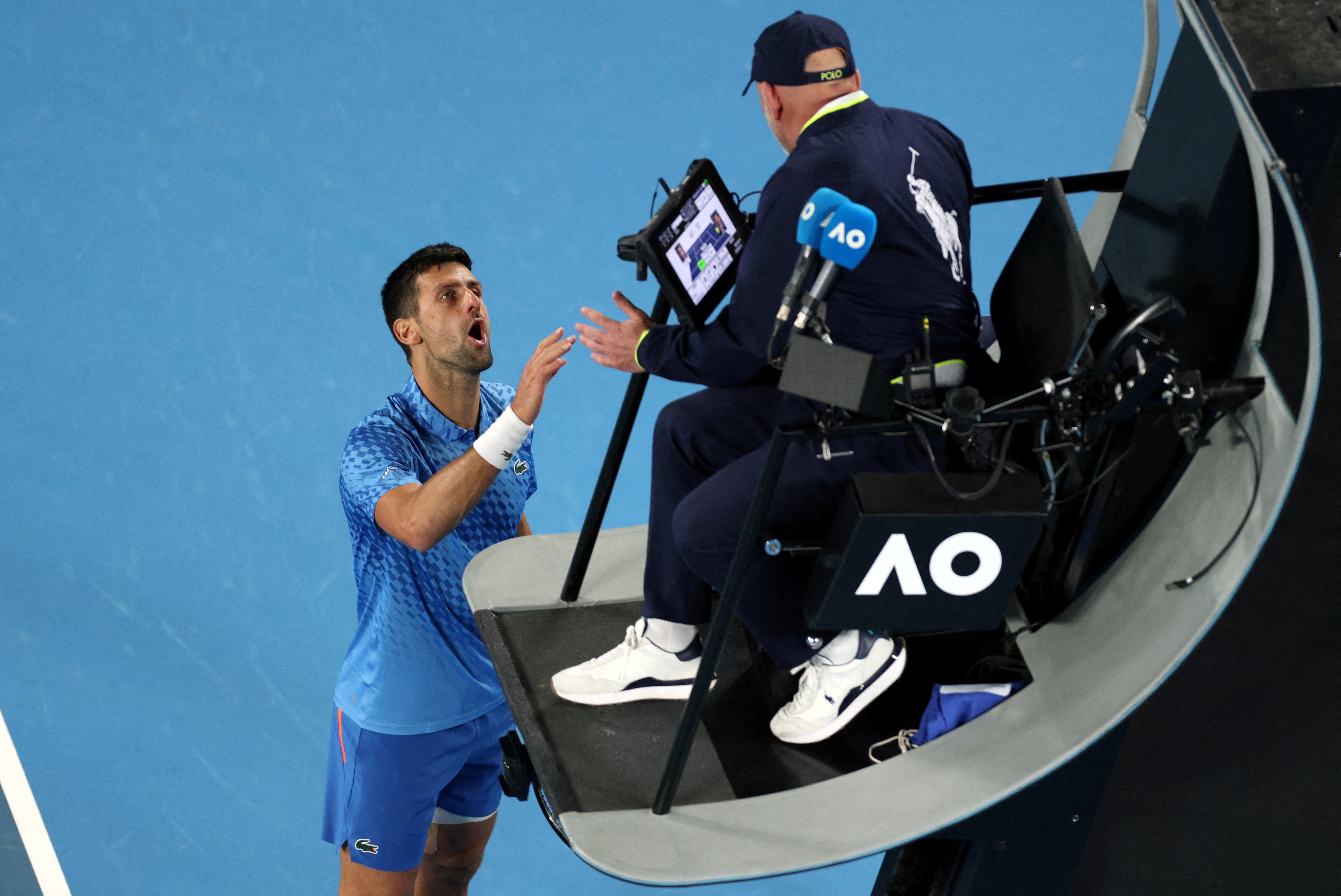 Tennis - Australian Open - Melbourne Park, Melbourne, Australia - January 19, 2023 Serbia's Novak Djokovic remonstrates with the umpire during his second round match against France's Enzo Couacaud REUTERS/Loren Elliott     TPX IMAGES OF THE DAY