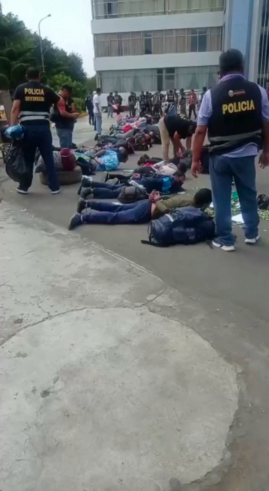 Police officers detain people at University San Marcos, in Lima, Peru January 21, 2023, in this screen grab taken from a social media video. Frente de egresados de la UNMSM/via REUTERS  THIS IMAGE HAS BEEN SUPPLIED BY A THIRD PARTY. MANDATORY CREDIT. NO RESALES. NO ARCHIVES.