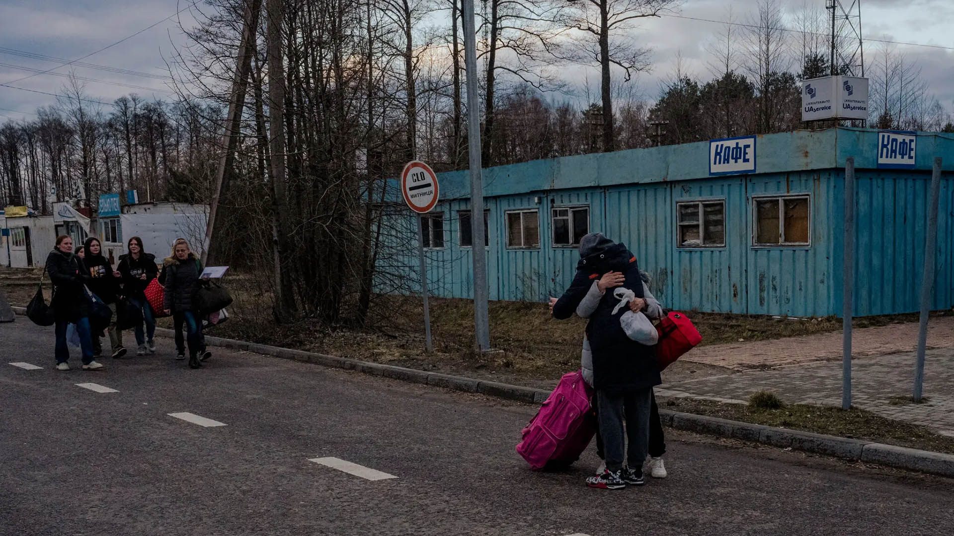 Natalya Zhornyk greets other mothers as they cross into Ukraine after picking up their children from schools and camps in Russia-occupied Ukraine, in Volyn Oblast, Ukraine, on March 21, 2023. (Daniel Berehulak/The New York Times)