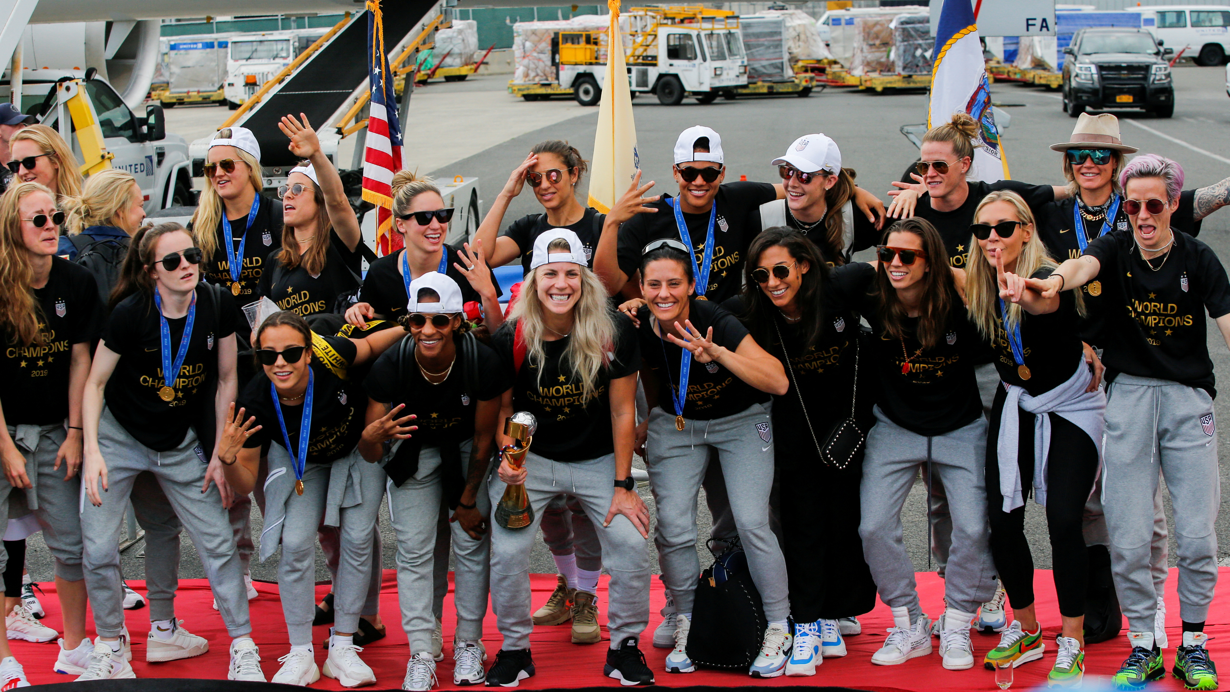 FILE PHOTO: U.S. women soccer players pose for a picture with the Trophy for the FIFA Women's World Cup while the team arrive to the Newark International Airport, in Newark, New Jersey, U.S., July 08, 2019. REUTERS/Eduardo Munoz/File Photo
