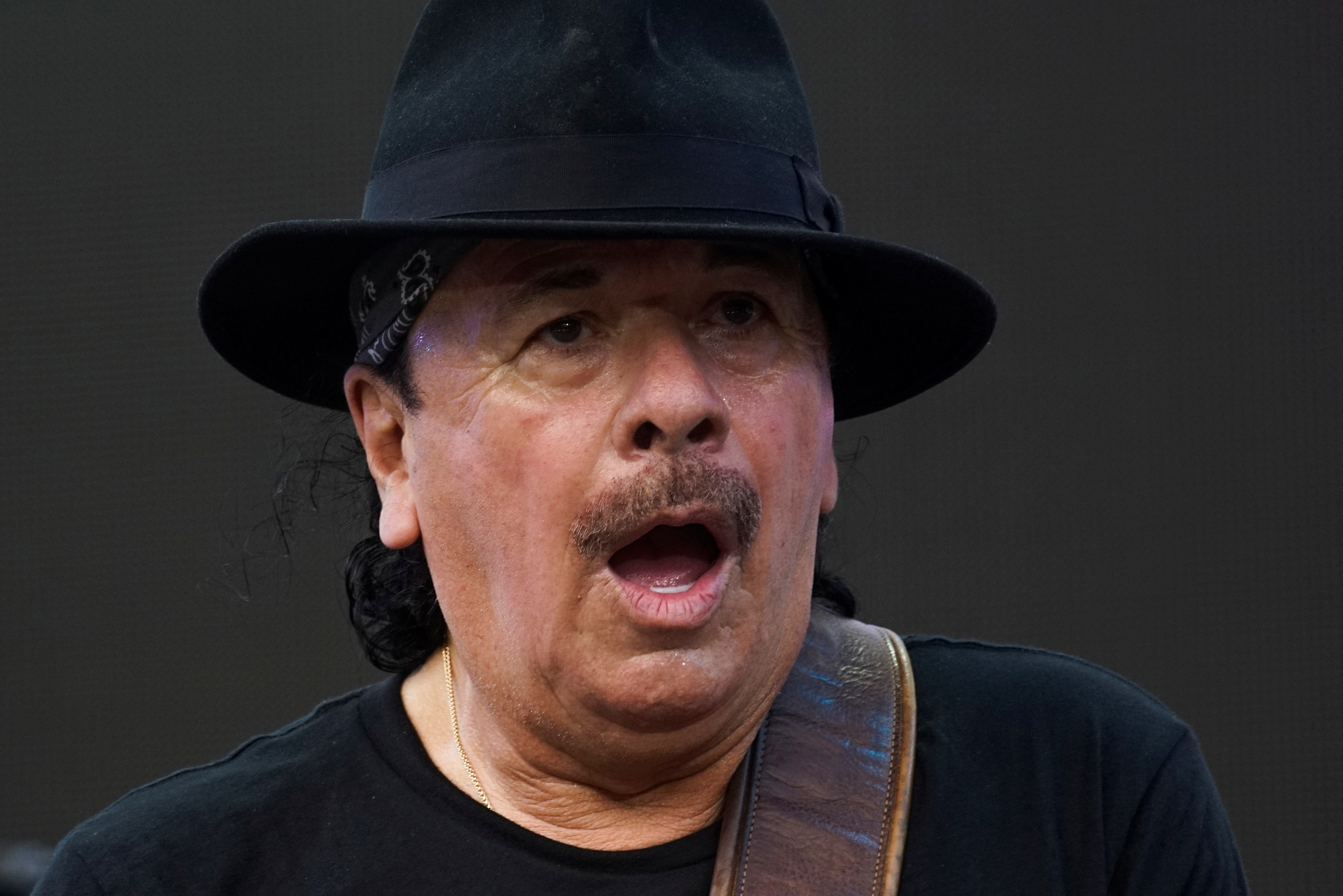 Carlos Santana suffered heat stroke midway through the concert and was replaced Photo: REUTERS/Eduardo Munoz
