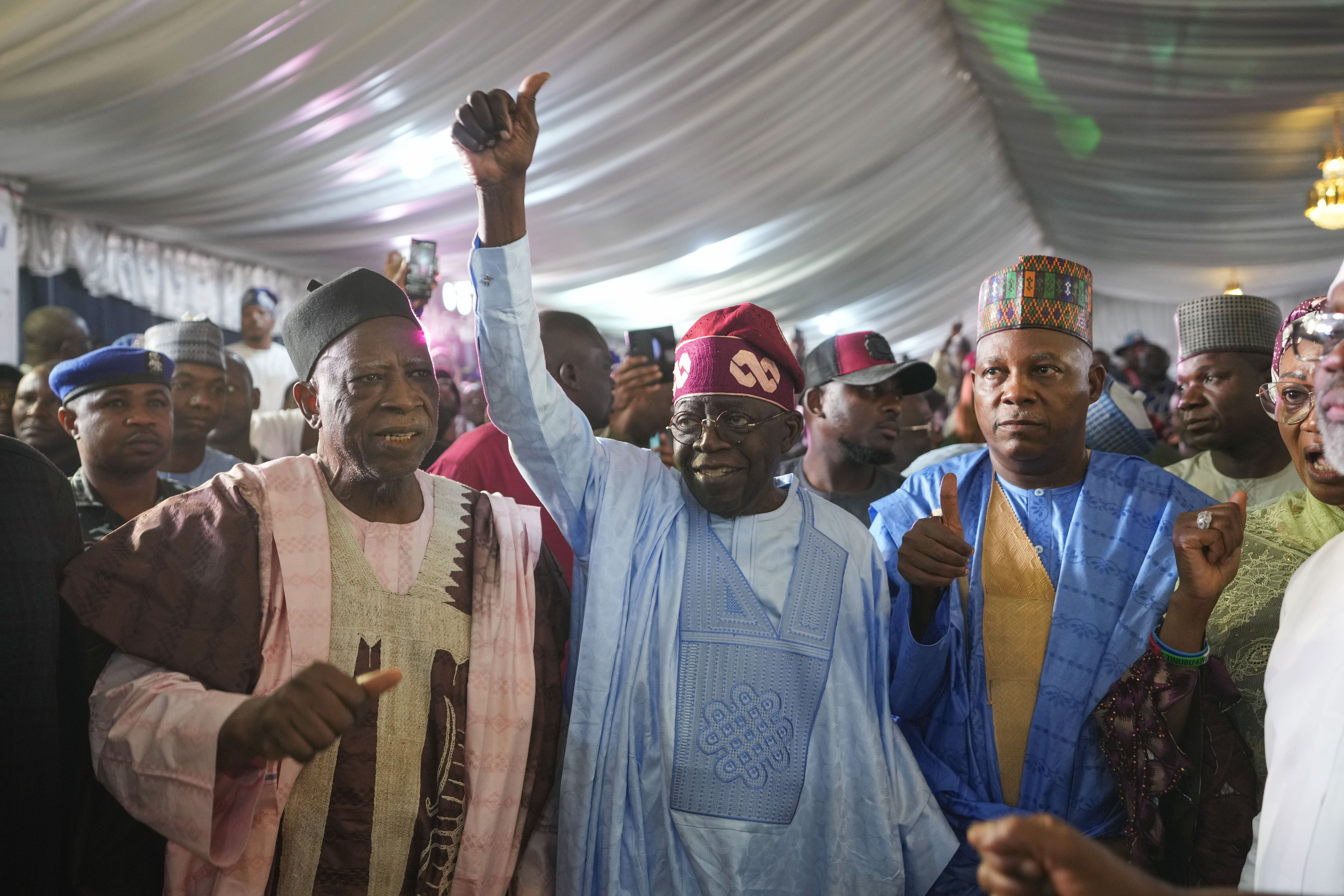 Bola Tinubu, center, of the All Progressives Congress, celebrates with supporters at his campaign headquarters after winning the presidential election, in Abuja, Nigeria, on March 1, 2023. (AP Photo/Ben Curtis)