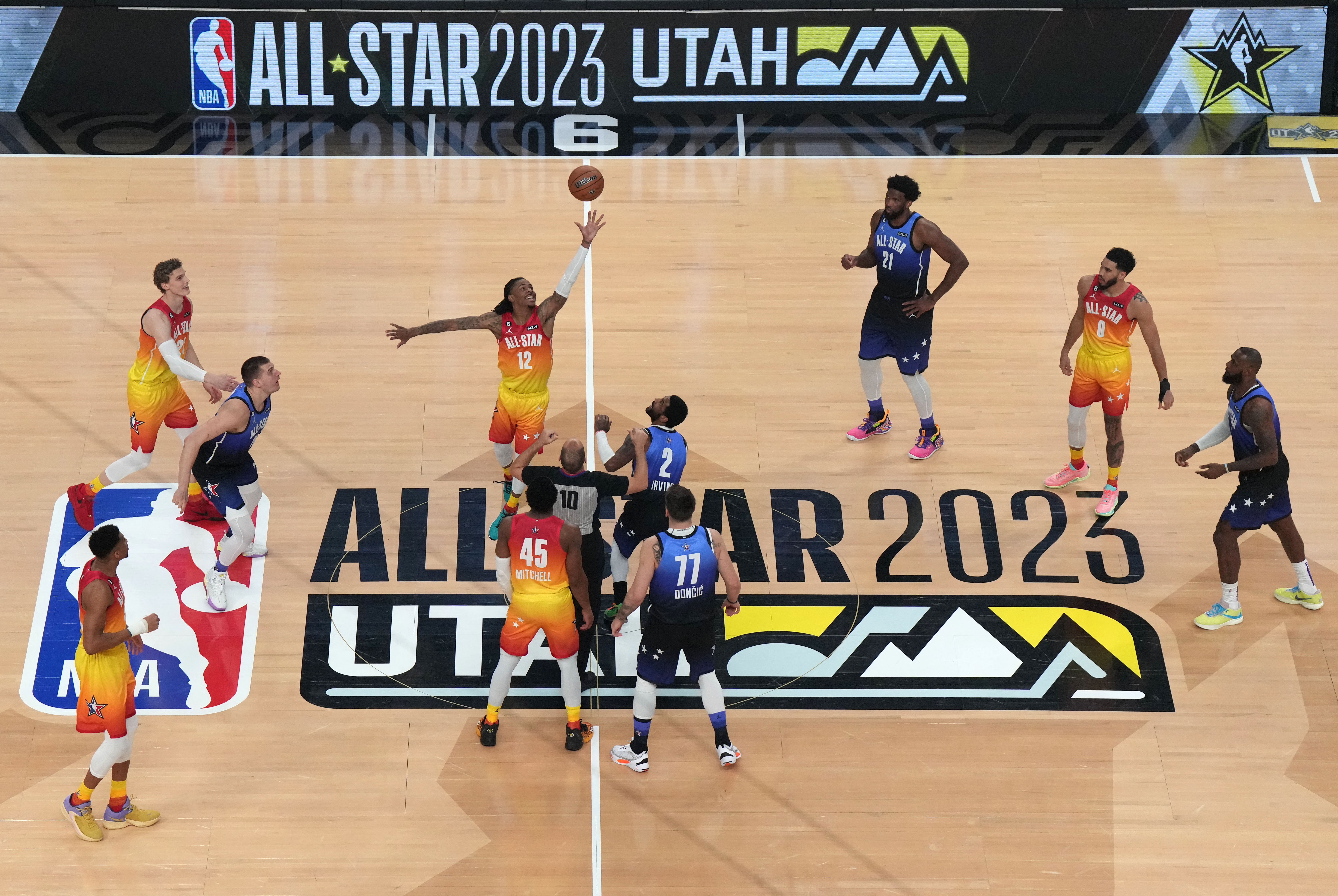 Feb 19, 2023; Salt Lake City, UT, USA; Team Giannis guard Ja Morant (12) takes the opening tip-off to start the 2023 NBA All-Star Game against Team LeBron at Vivint Arena. Mandatory Credit: Kirby Lee-USA TODAY Sports
