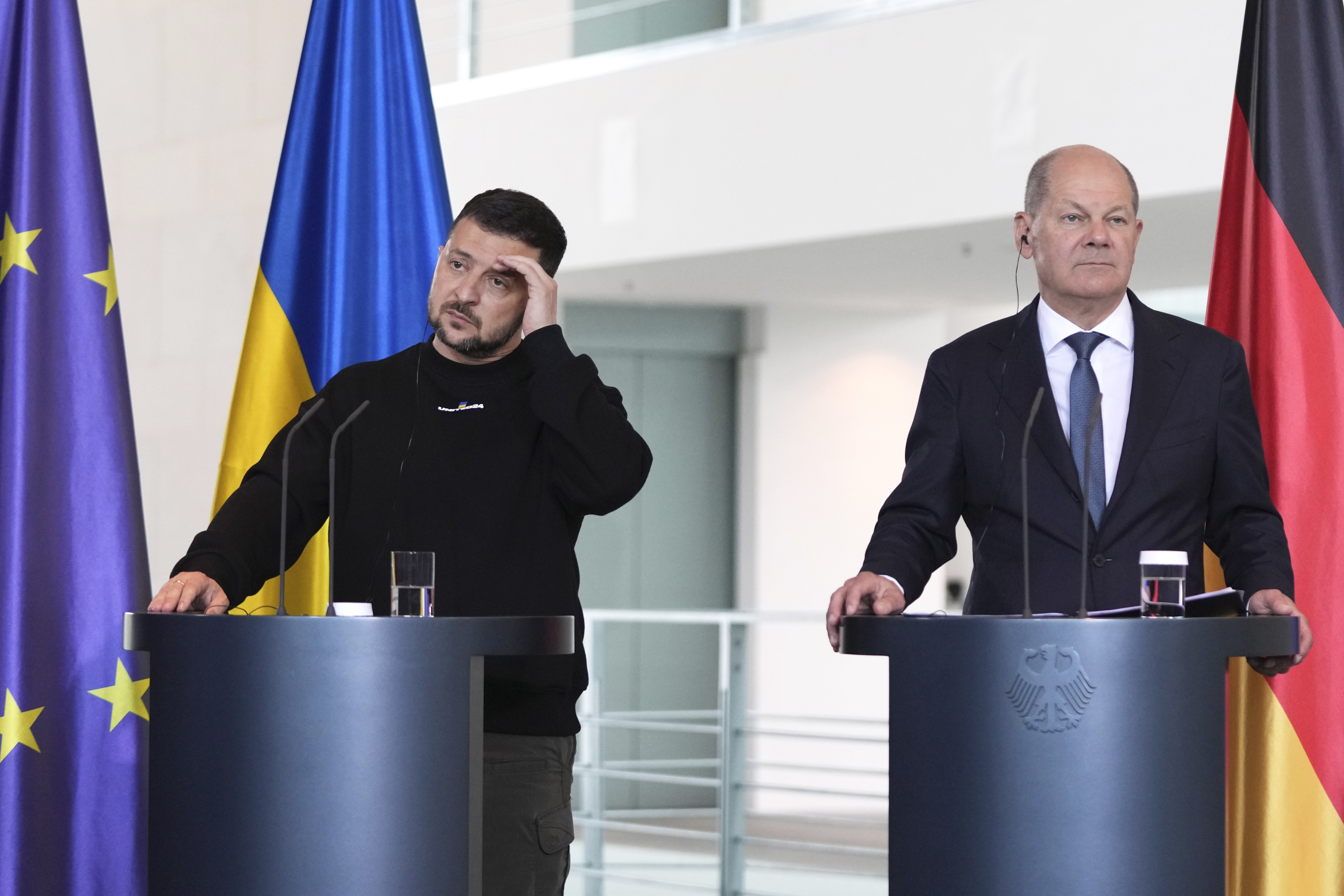 German Chancellor Olaf Scholz, right, and Ukrainian President Volodymyr Zelenskyy hold a news conference at the chancellery in Berlin, Germany, Sunday, May 14, 2023. (AP Photo/Matthias Schrader)