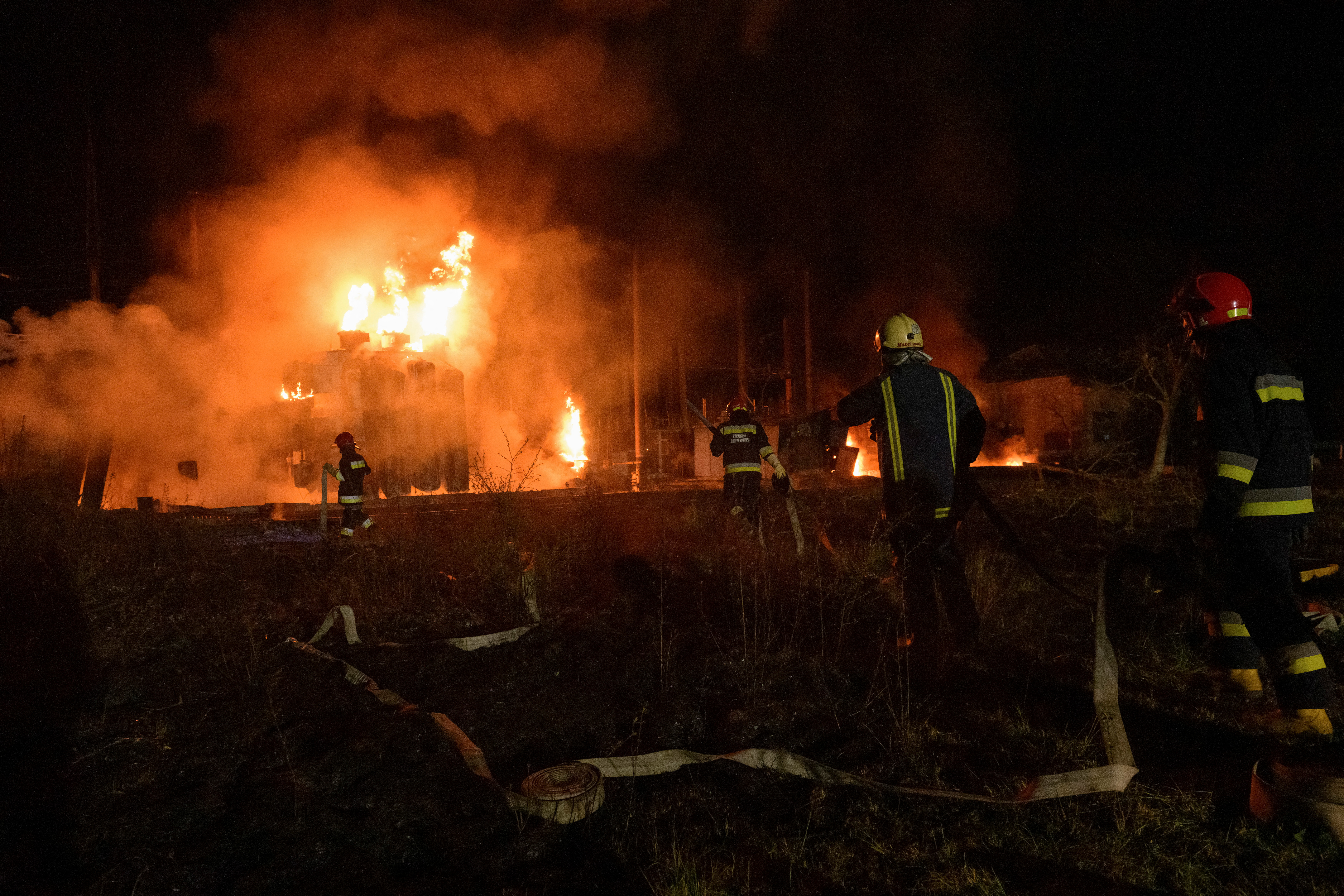 Firefighters work at a site of a power substation hit by a missile strike, as Russia's attack on Ukraine continues, in Lviv, Ukraine May 3, 2022. REUTERS/Andrii Gorb