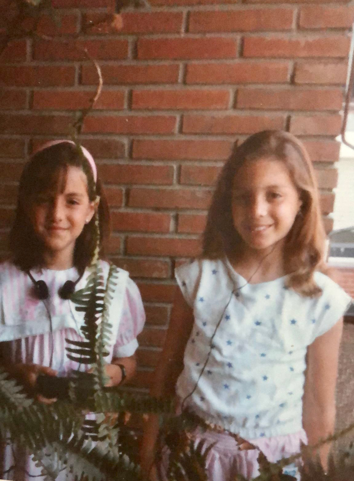 Susana (left) and her sister.  As a child, I listened to music and stories told with a walkman