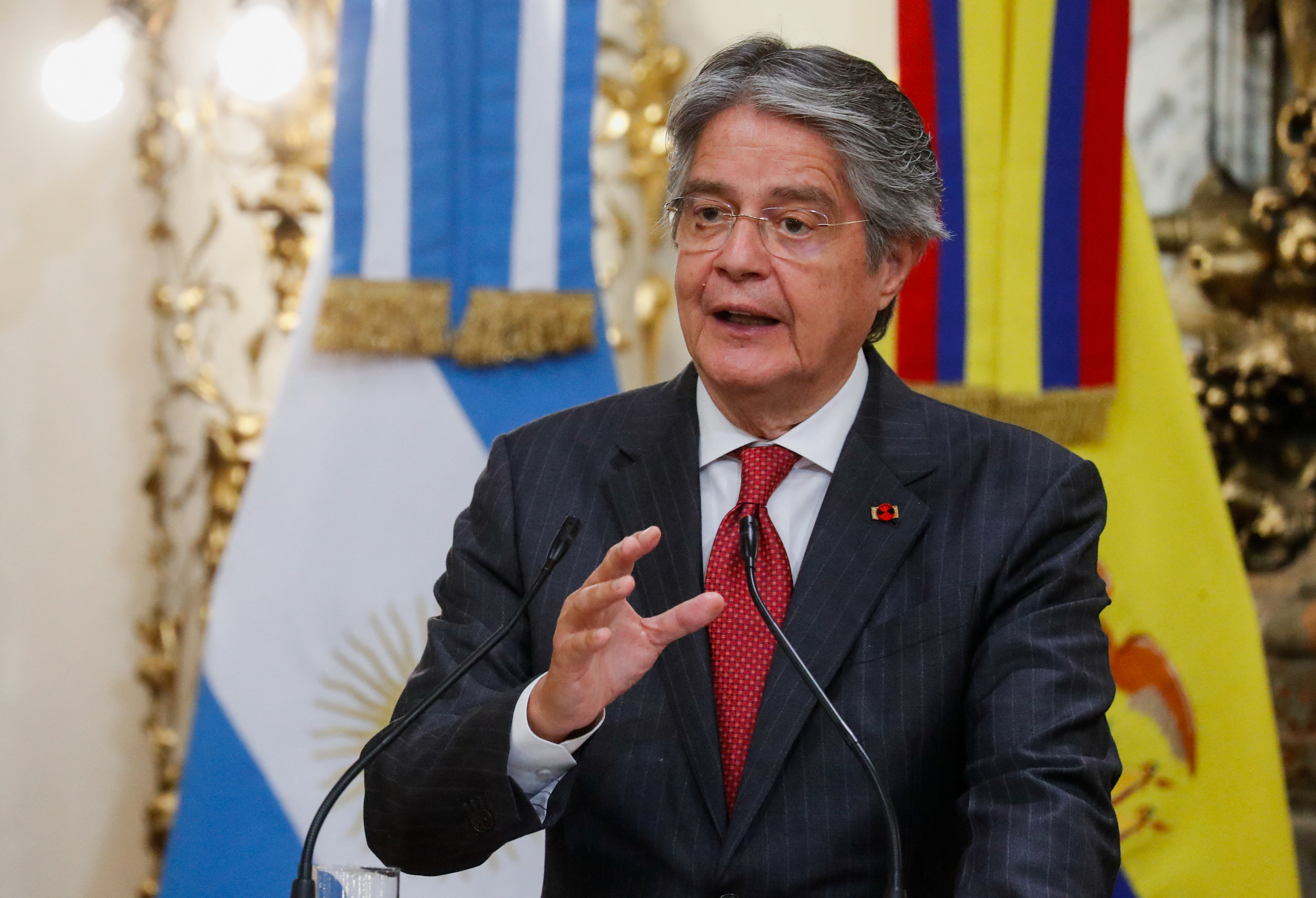 Ecuador's President Guillermo Lasso speaks as he attends a bilateral agreement signing ceremony with Argentina's President Alberto Fernandez (not pictured) at the Casa Rosada presidential palace in Buenos Aires, Argentina, April 18, 2022. REUTERS/Agustin Marcarian