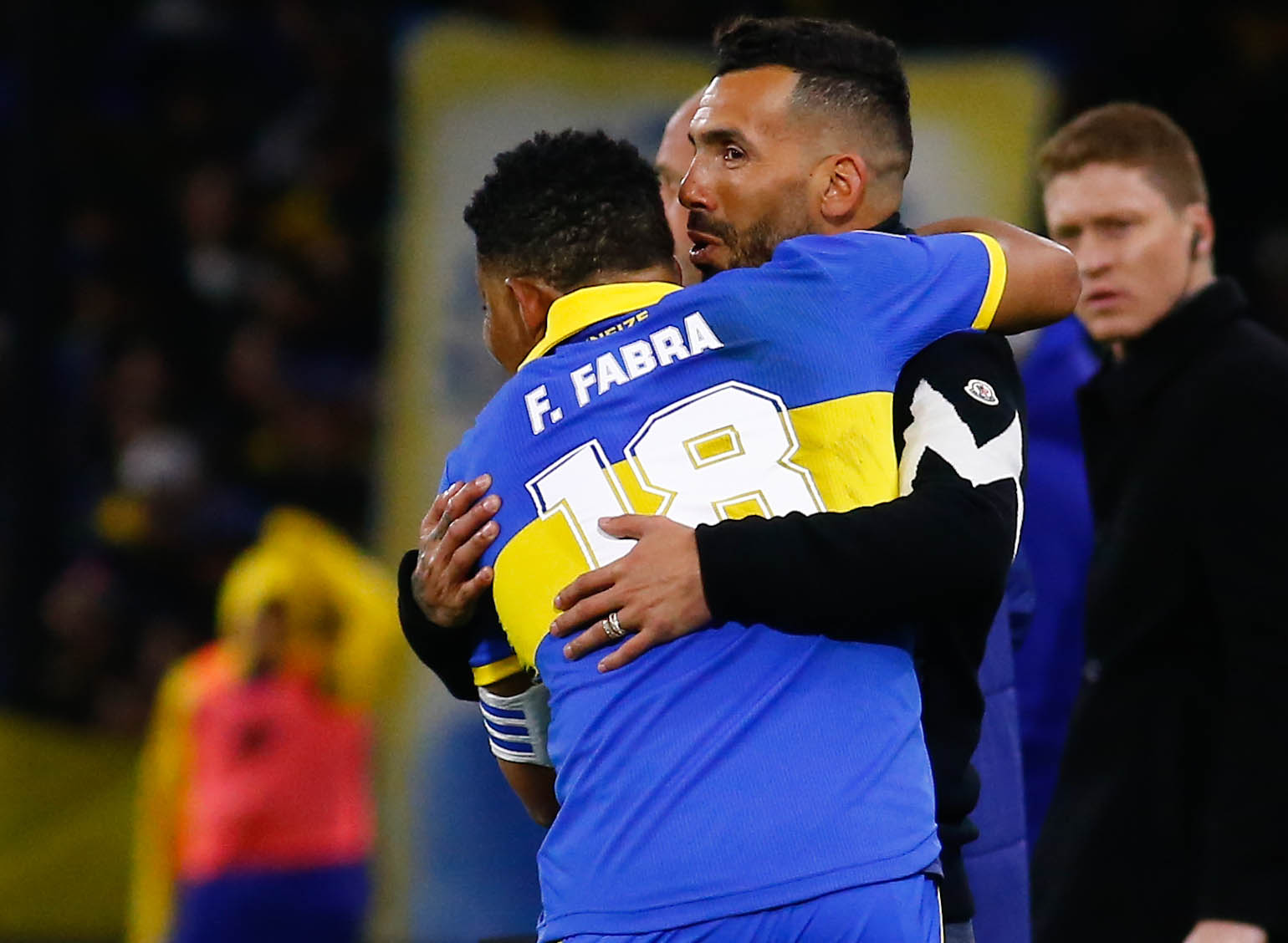 Tevez and Fabra merged in a hug