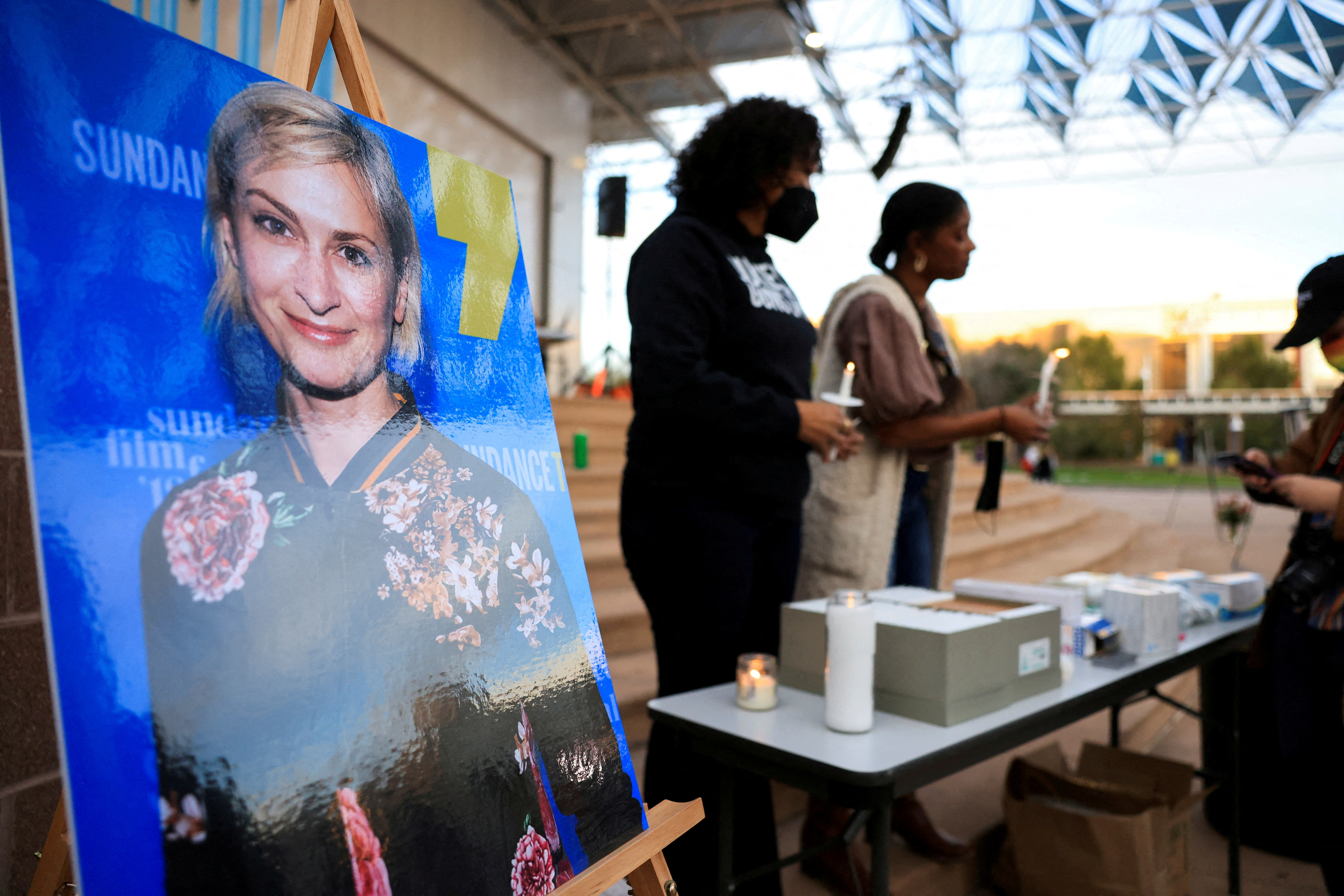 An image of cinematographer Halyna Hutchins, who died after being shot by Alec Baldwin on the set of her film "Rust"is shown at a vigil in his honor in Albuquerque, New Mexico, U.S., October 23, 2021. REUTERS