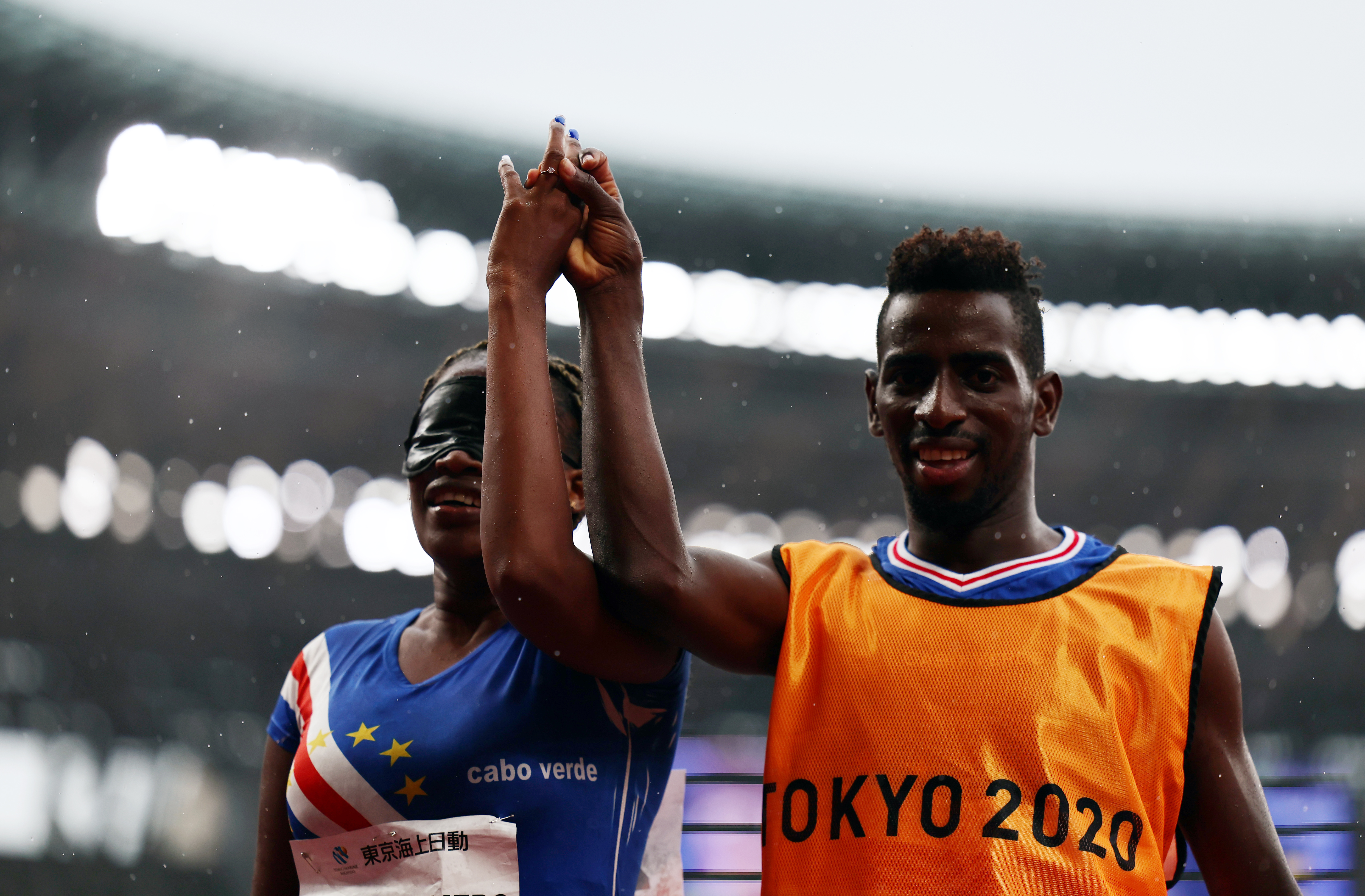 Tokyo 2020 Paralympic Games - Athletics - Women's 200m - T11 Round 1 - Heat 4 - Olympic Stadium, Tokyo, Japan - September 2, 2021. Keula Nidreia Pereira Semedo of Cape Verde displays her ring after her guide Manuel Antonio Vaz da Veiga proposed after competing REUTERS/Athit Perawongmetha