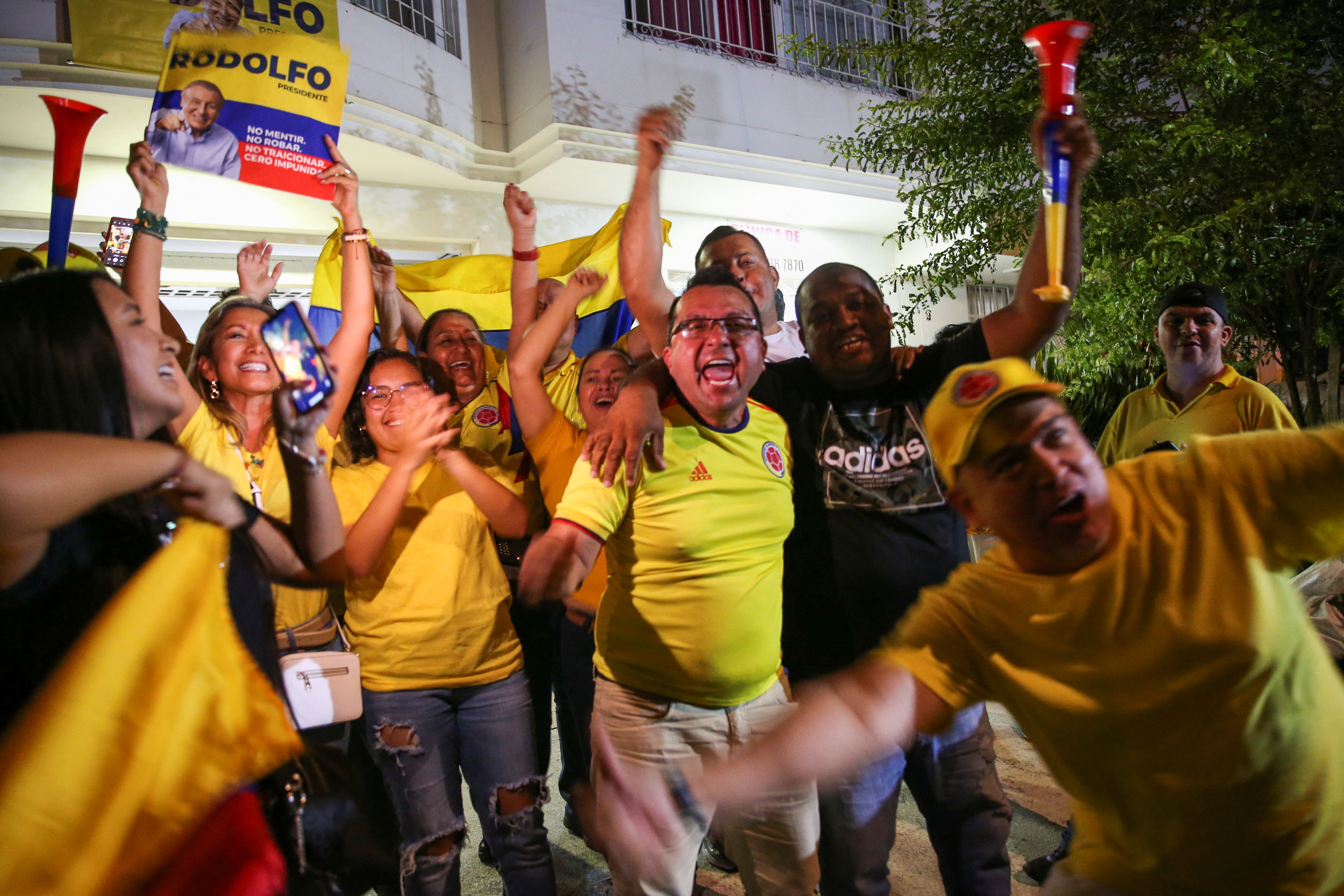 Supporters of Colombian centre-right presidential candidate Rodolfo Hernandez of Anti-Corruption Rulers' League Party react after he came out second in the first round of the presidential election in Cali, Colombia May 29, 2022. REUTERS/Luisa Gonzalez