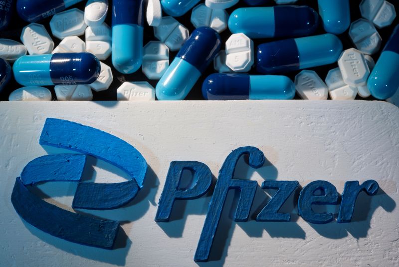 FILE PHOTO: A 3D-printed Pfizer logo is placed near medicines from the same manufacturer in this illustration taken on September 29, 2021. REUTERS/Dado Ruvic/Illustration/File