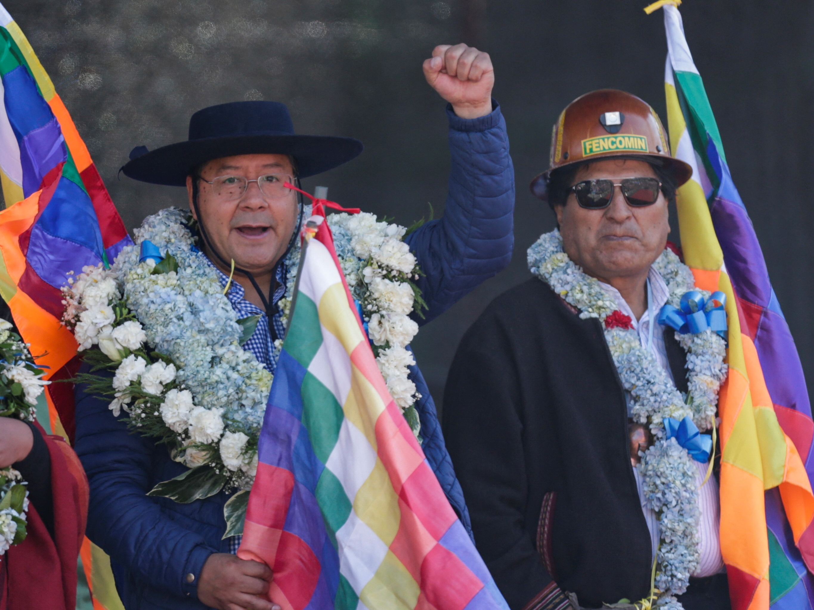 Bolivian President Luis Arce Catacora stands with former President Evo Morales as they march with supporters of the Bolivian MAS party, workers and coca producers to show their support for Arce's government in La Paz, Bolivia.  REUTERS/Manuel Claire