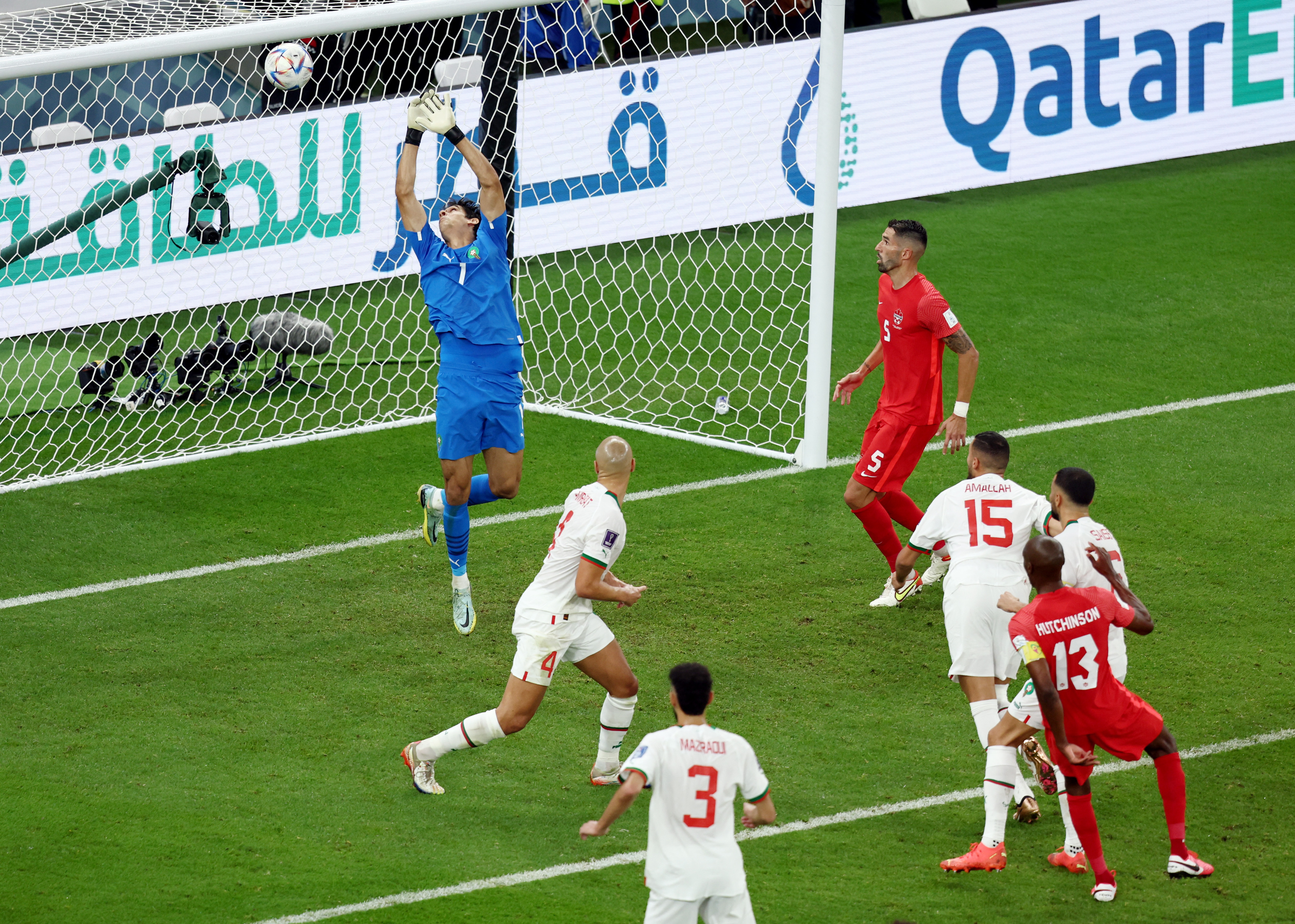 Yassine Bounou watches Atiba Hutchinson's shot which ends up hitting the crossbar.  REUTERS/Marko Djurica