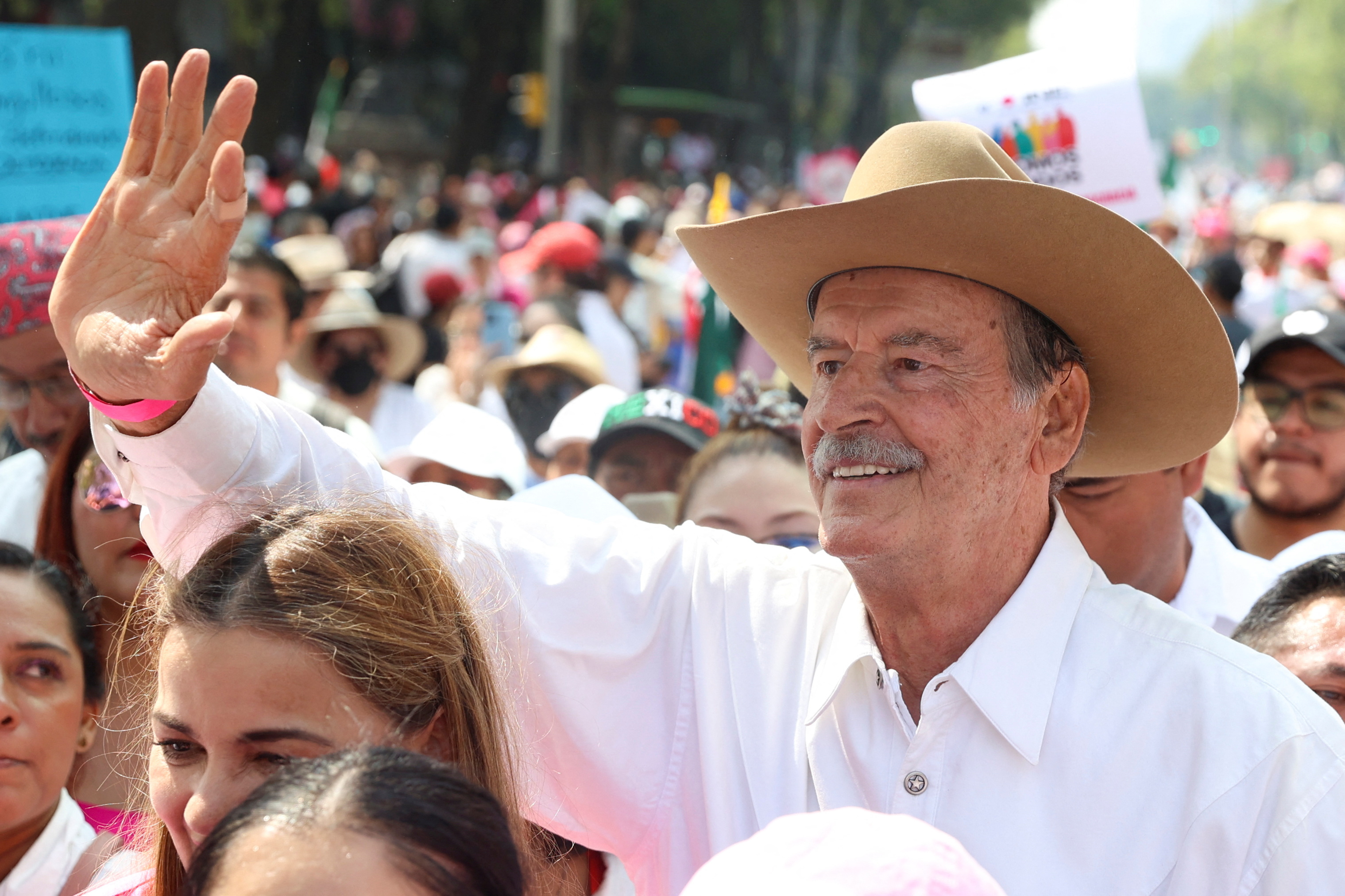 Former President Vicente Fox Quesada waves as demonstrators march against the electoral reform proposed by Mexican President Andres Manuel Lopez Obrador and in support of the National Electoral Institute (INE) in Mexico City, Mexico, November 13, 2022. REUTERS/Luis Cortes