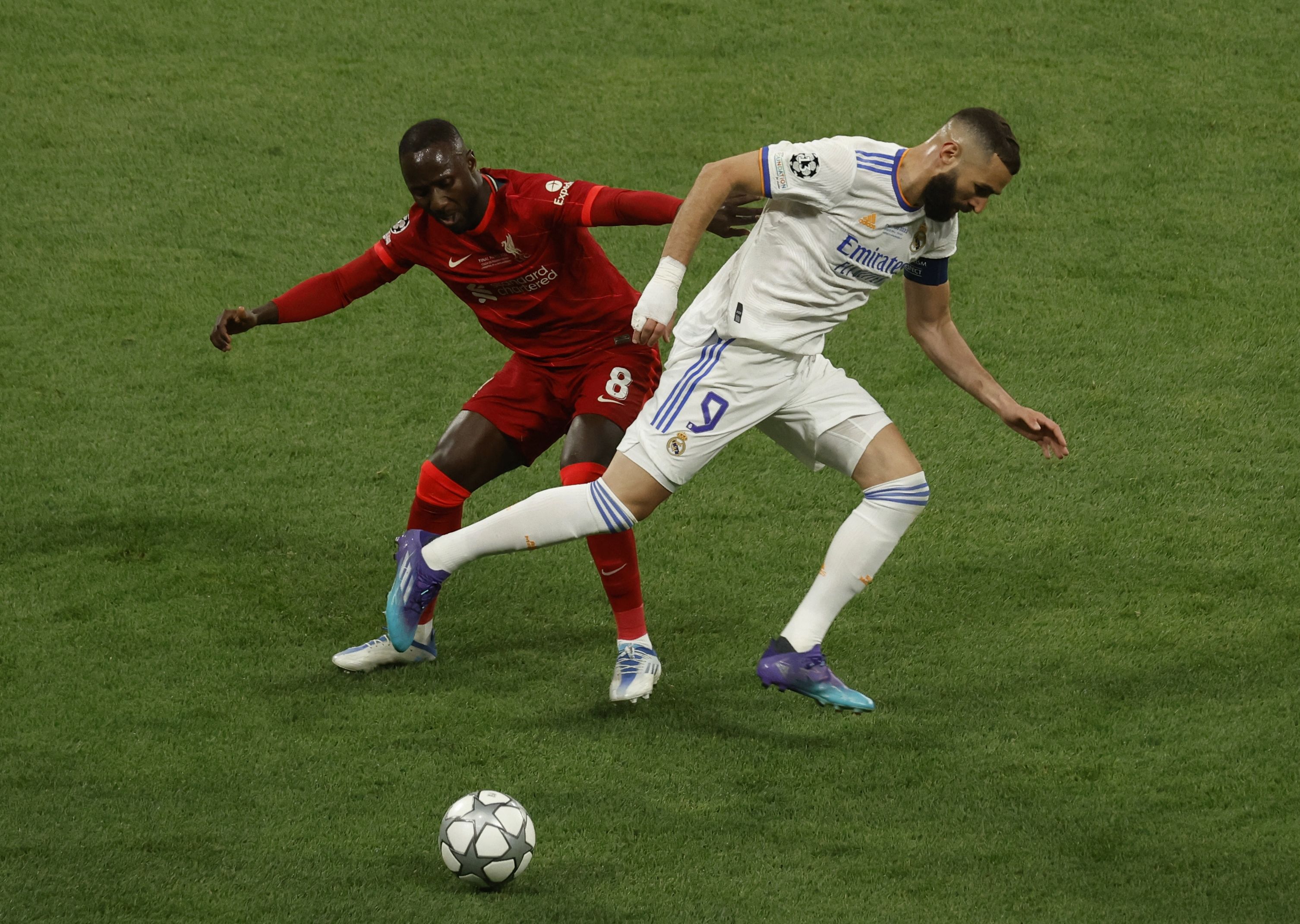Soccer Football - Champions League Final - Liverpool v Real Madrid - Stade de France, Saint-Denis near Paris, France - May 28, 2022  Liverpool's Naby Keita in action with Real Madrid's Karim Benzema REUTERS/Gonzalo Fuentes