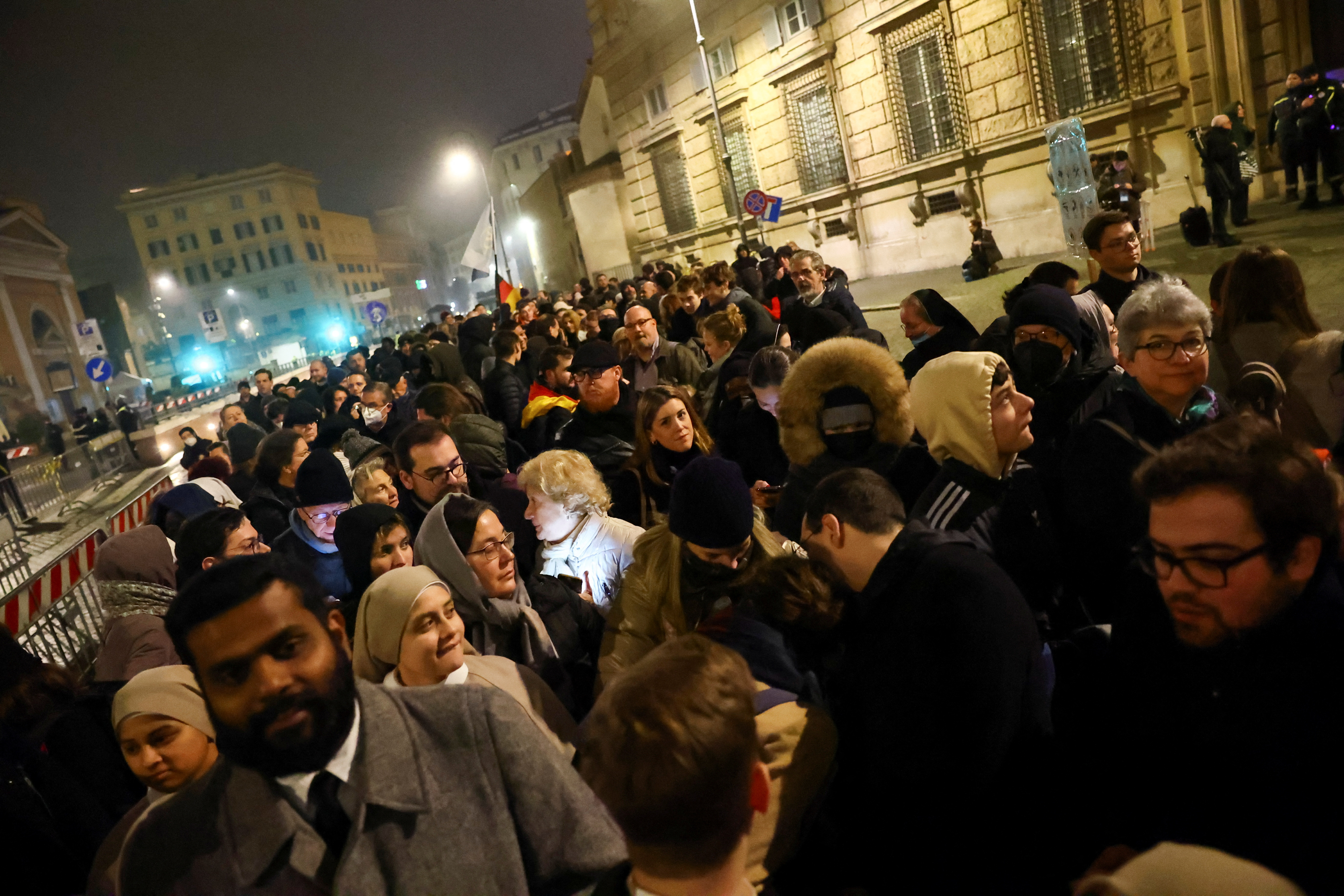 The faithful wait to enter St. Peter's Square.  (REUTERS/Kai Pfaffenbach)