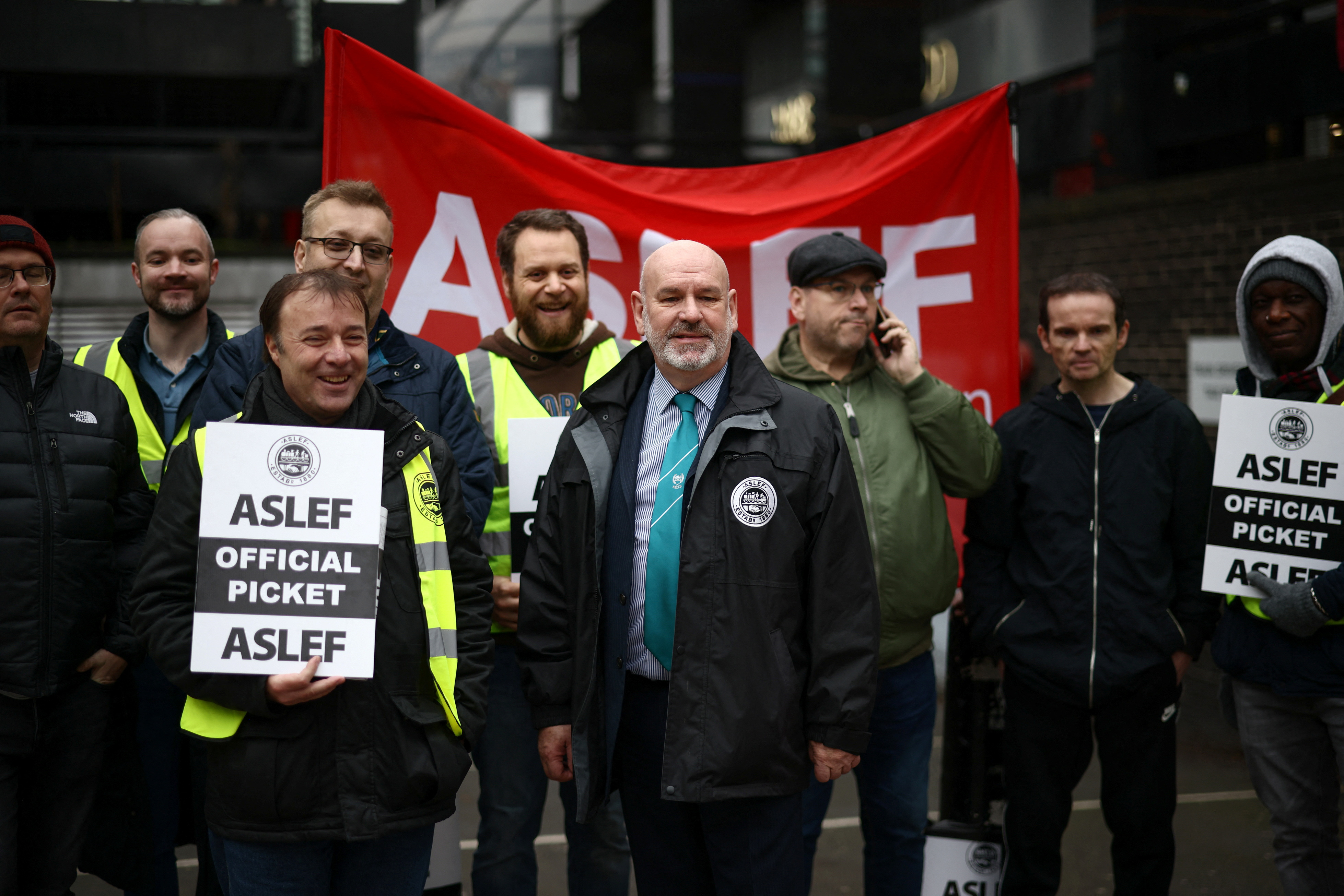 ASLEF general secretary Mick Whelan stands with other union members on a picket line outside Euston station during the strike in London, Britain January 5, 2023. REUTERS/Henry Nicholls