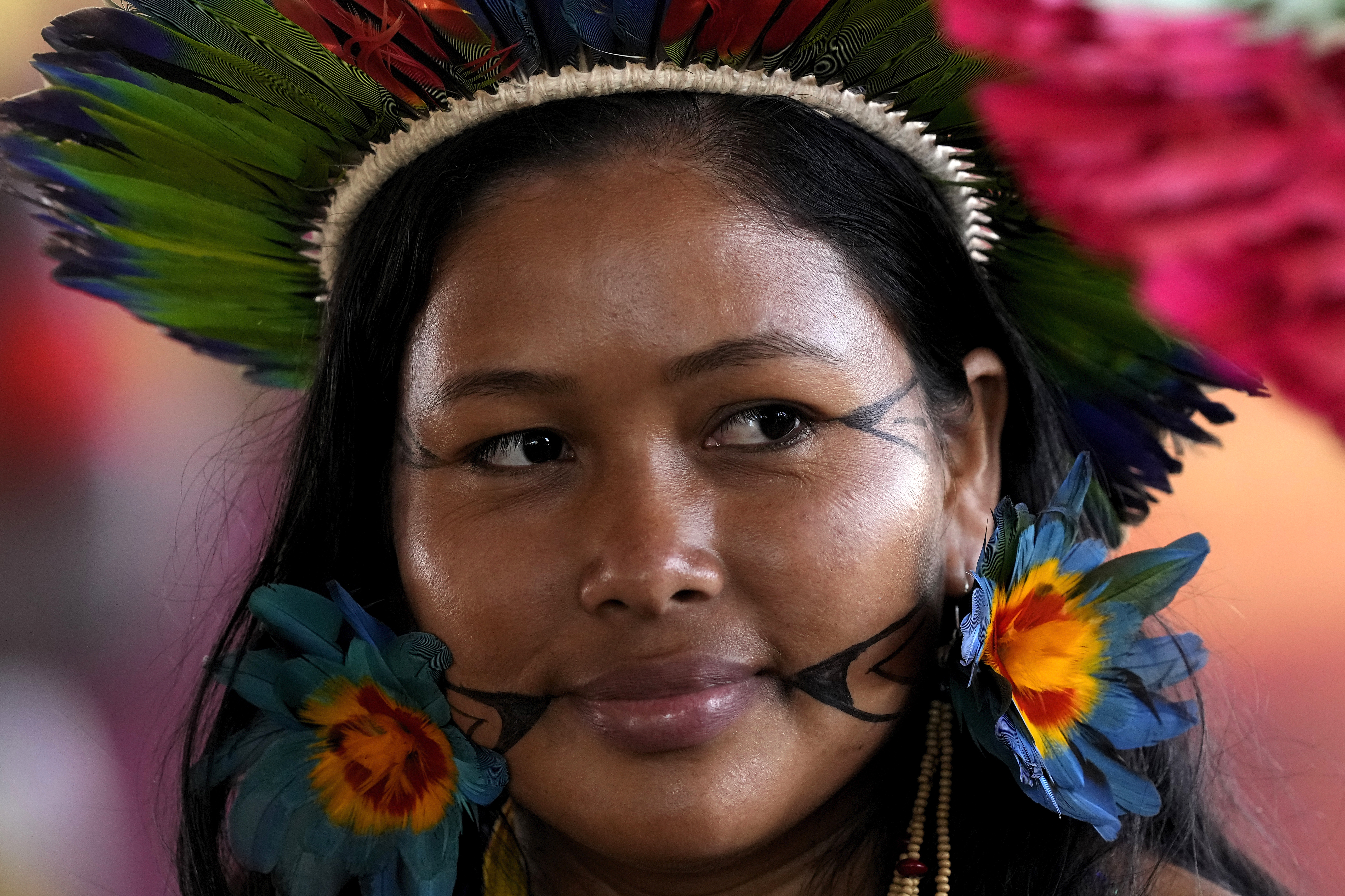 An indigenous woman attends the closing ceremony of the annual Terra Livre camp in Brasilia, Brazil, on April 28, 2023. (AP Photo/Eraldo Peres)