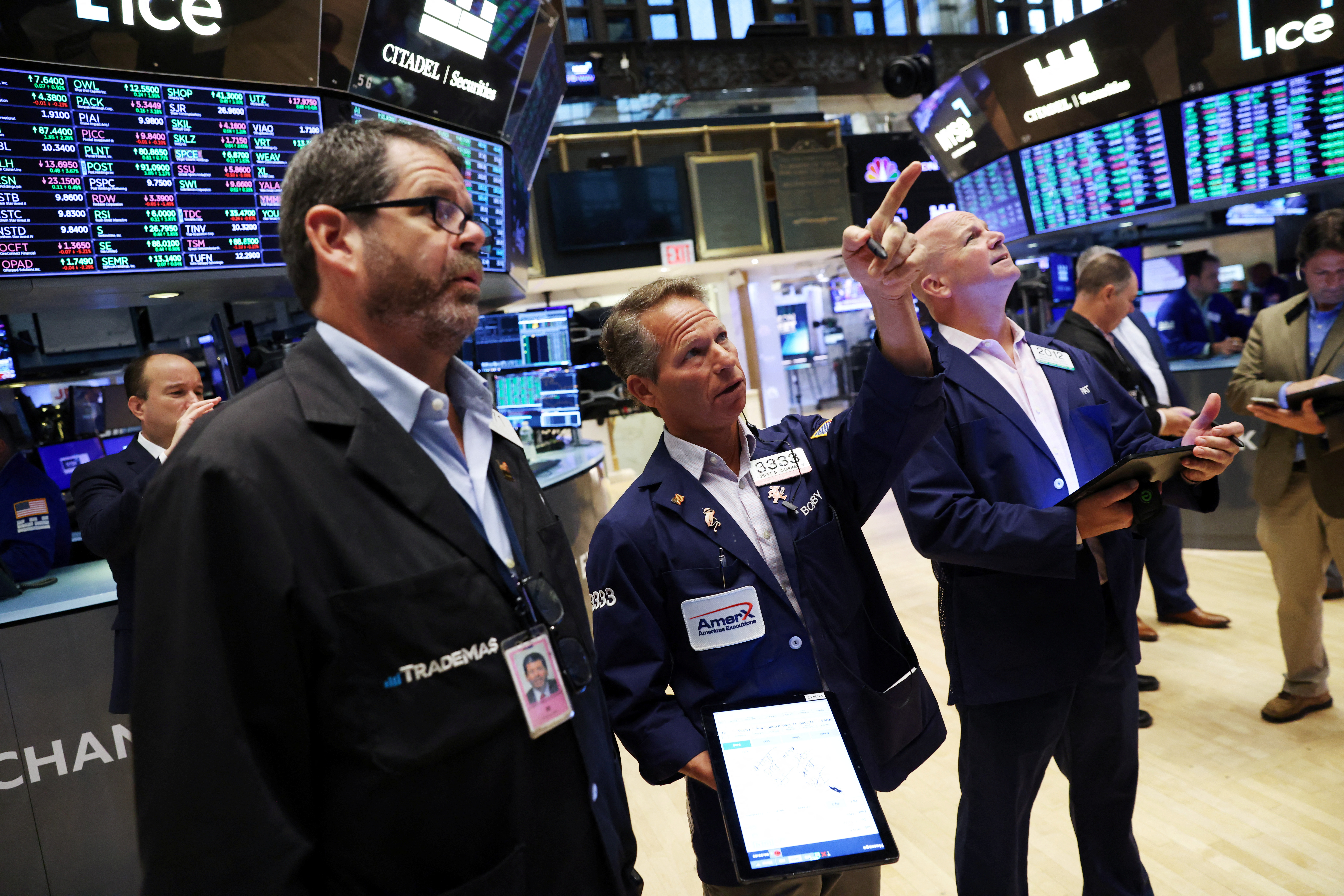 Traders work on the trading floor at the New York Stock Exchange (NYSE) in Manhattan, New York City, U.S., August 8, 2022. REUTERS/Andrew Kelly