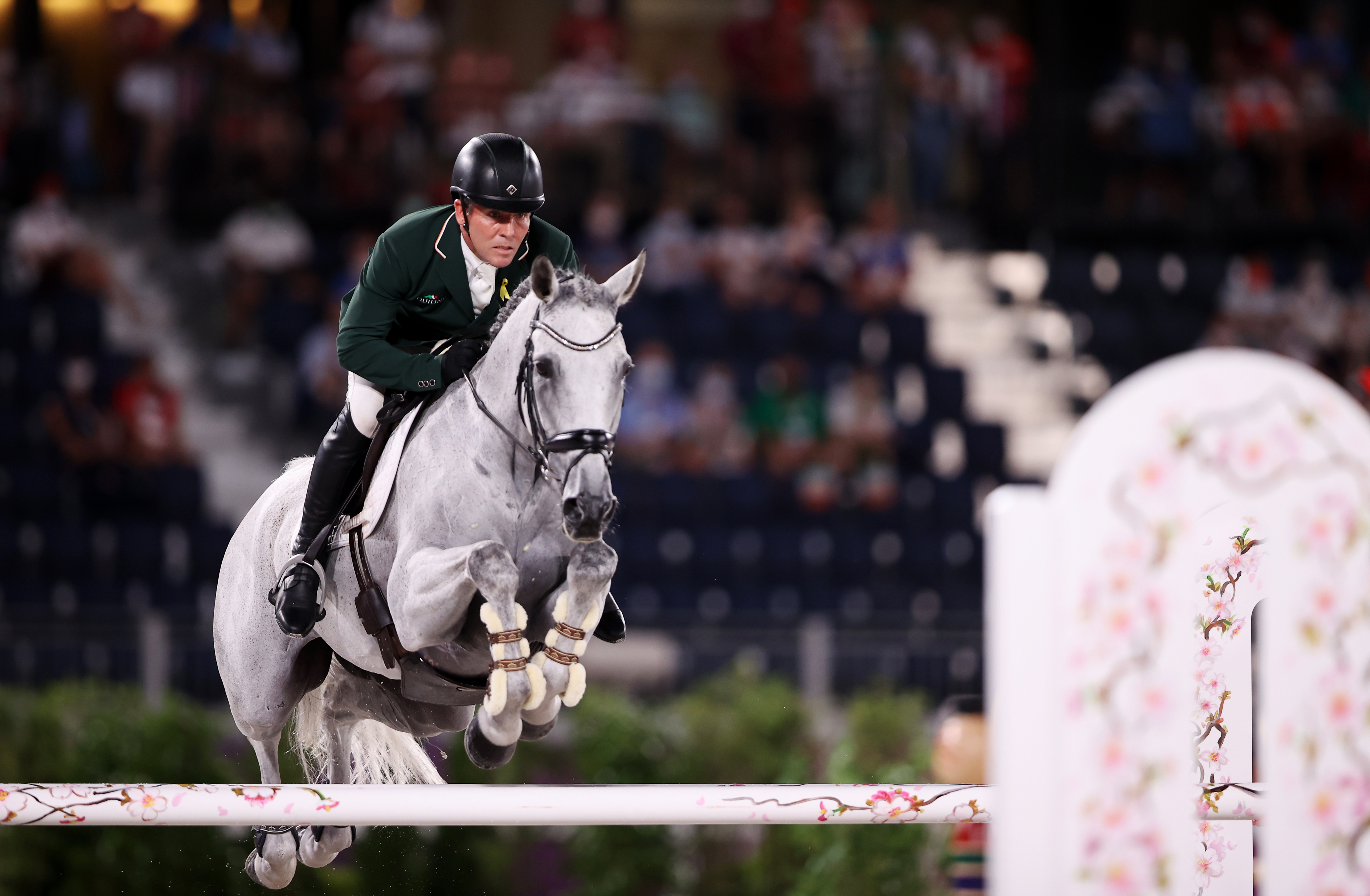 Tokyo 2020 Olympics - Equestrian - Eventing - Jumping Individual - Final - Equestrian Park - Tokyo, Japan - August 2, 2021. Austin O'Connor of Ireland on his horse Colorado Blue competes. REUTERS/Molly Darlington