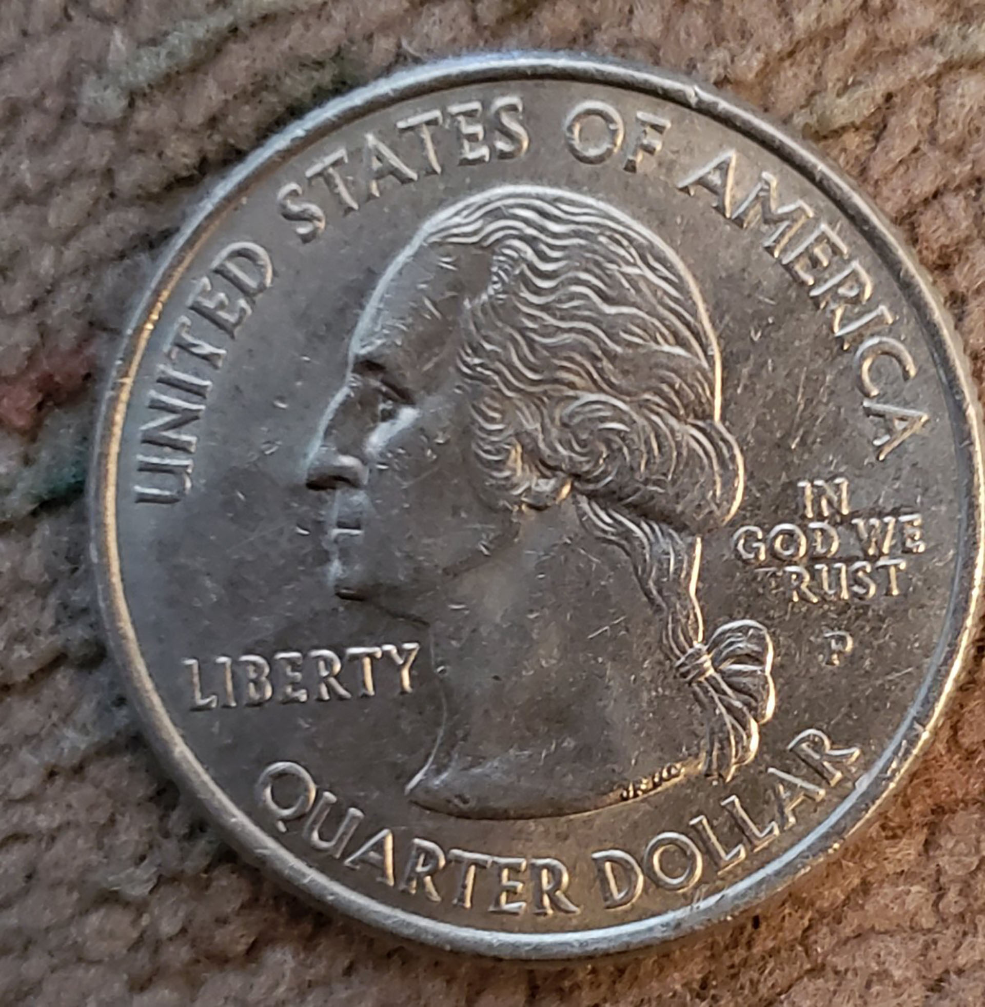 Uno de los ejemplares de monedas con la leyenda "In God we Rust". Fuente: coincommunity.com