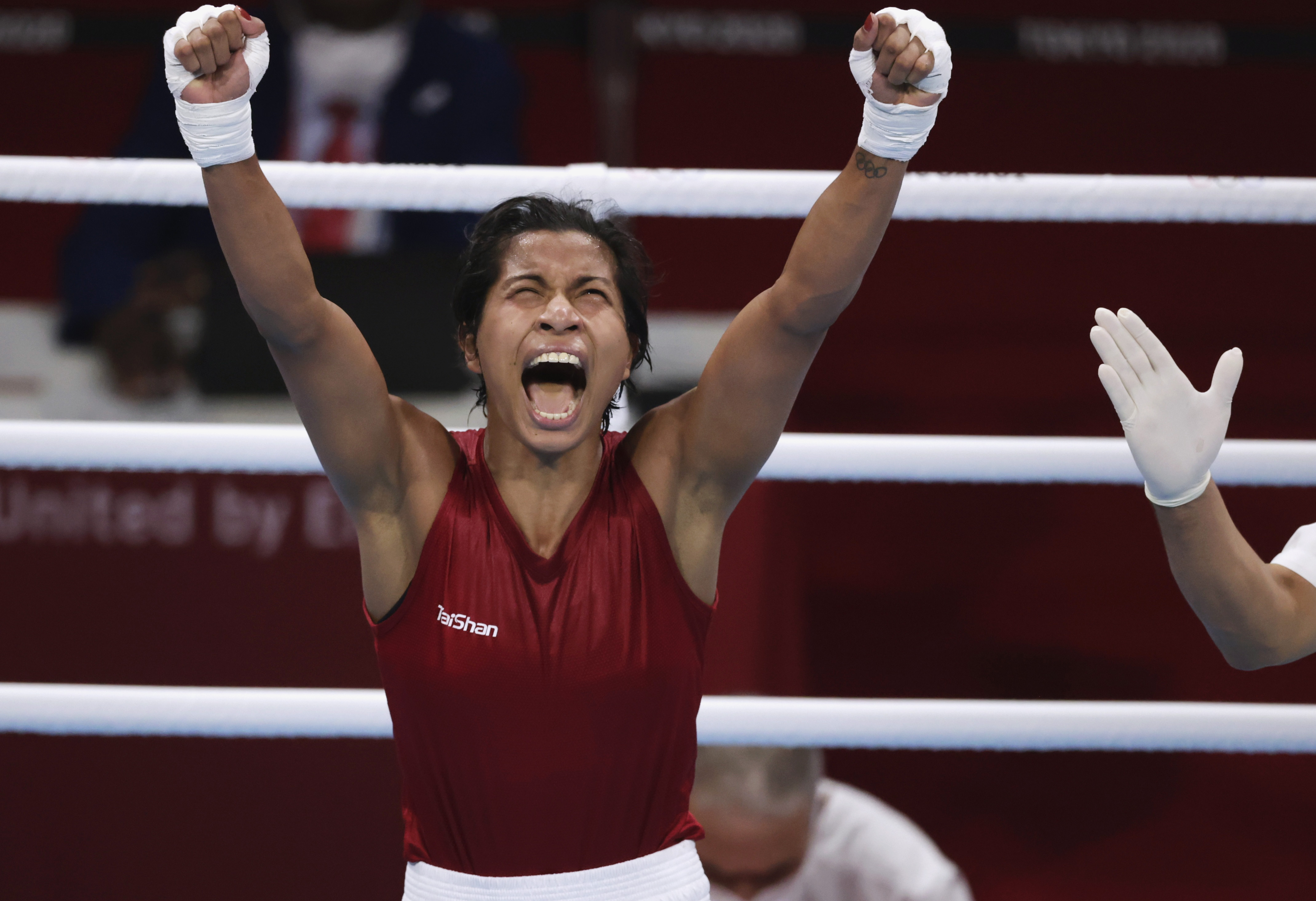 Tokyo 2020 Olympics - Boxing - Women's Welterweight - Quarterfinal - Kokugikan Arena - Tokyo, Japan - July 30, 2021. Lovlina Borgohain of India celebrates after the fight against Chen Nien-Chin of Taiwan. REUTERS/Ueslei Marcelino