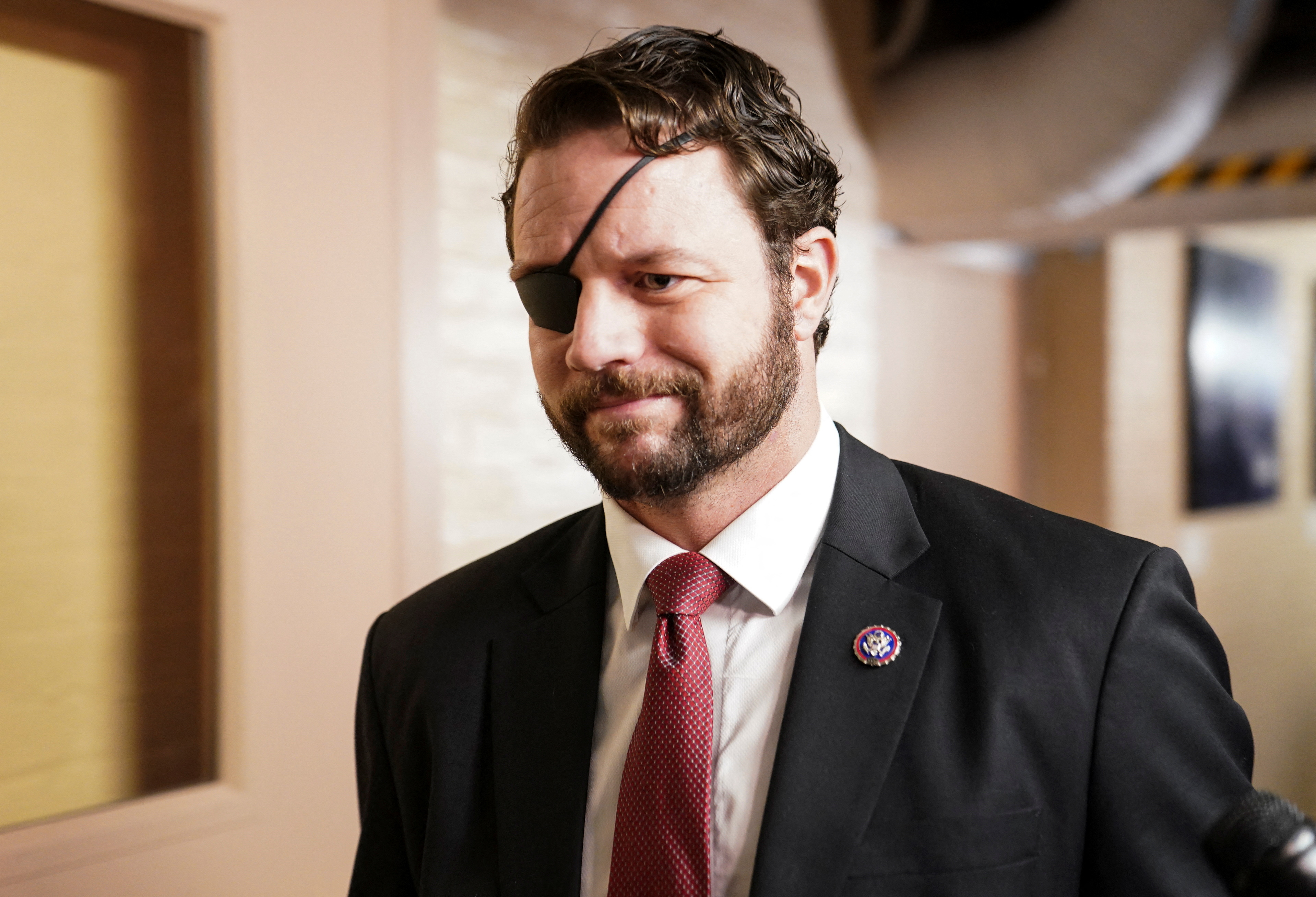 US Rep. Dan Crenshaw (R-TX) walks to a House GOP Caucus meeting at the US Capitol on the first day of the new Congress in Washington, US, January 3, 2023. REUTERS/Jon Cherry