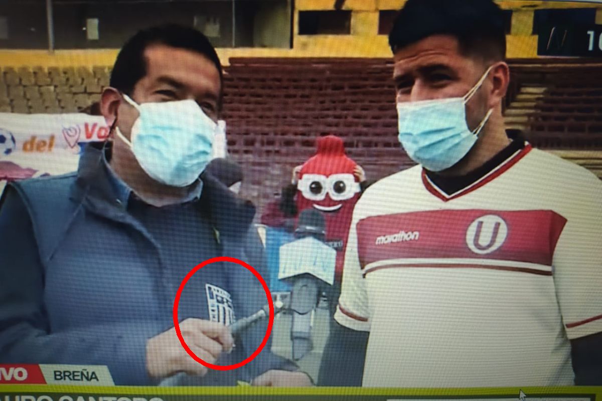 Reportero le muestra la camiseta de Alianza Lima a Mauro Cantoro. (Canal N)