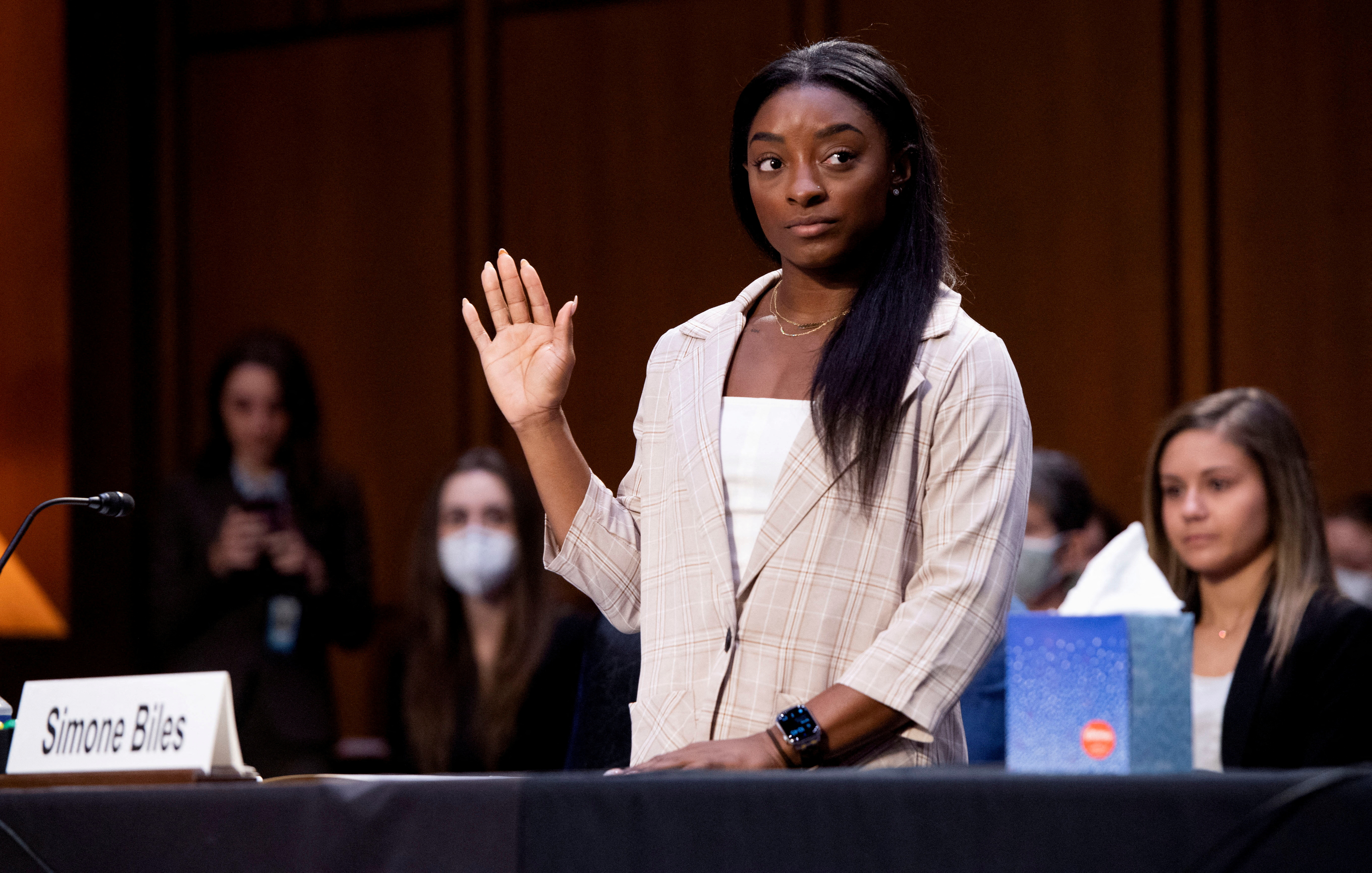 FILE PHOTO: U.S. Olympic gymnast Simone Biles is sworn in to testify during a Senate Judiciary hearing about the Inspector General's report on the FBI handling of the Larry Nassar investigation of sexual abuse of Olympic gymnasts, on Capitol Hill, in Washington, D.C., U.S., September 15, 2021. Saul Loeb/Pool via REUTERS/File Photo