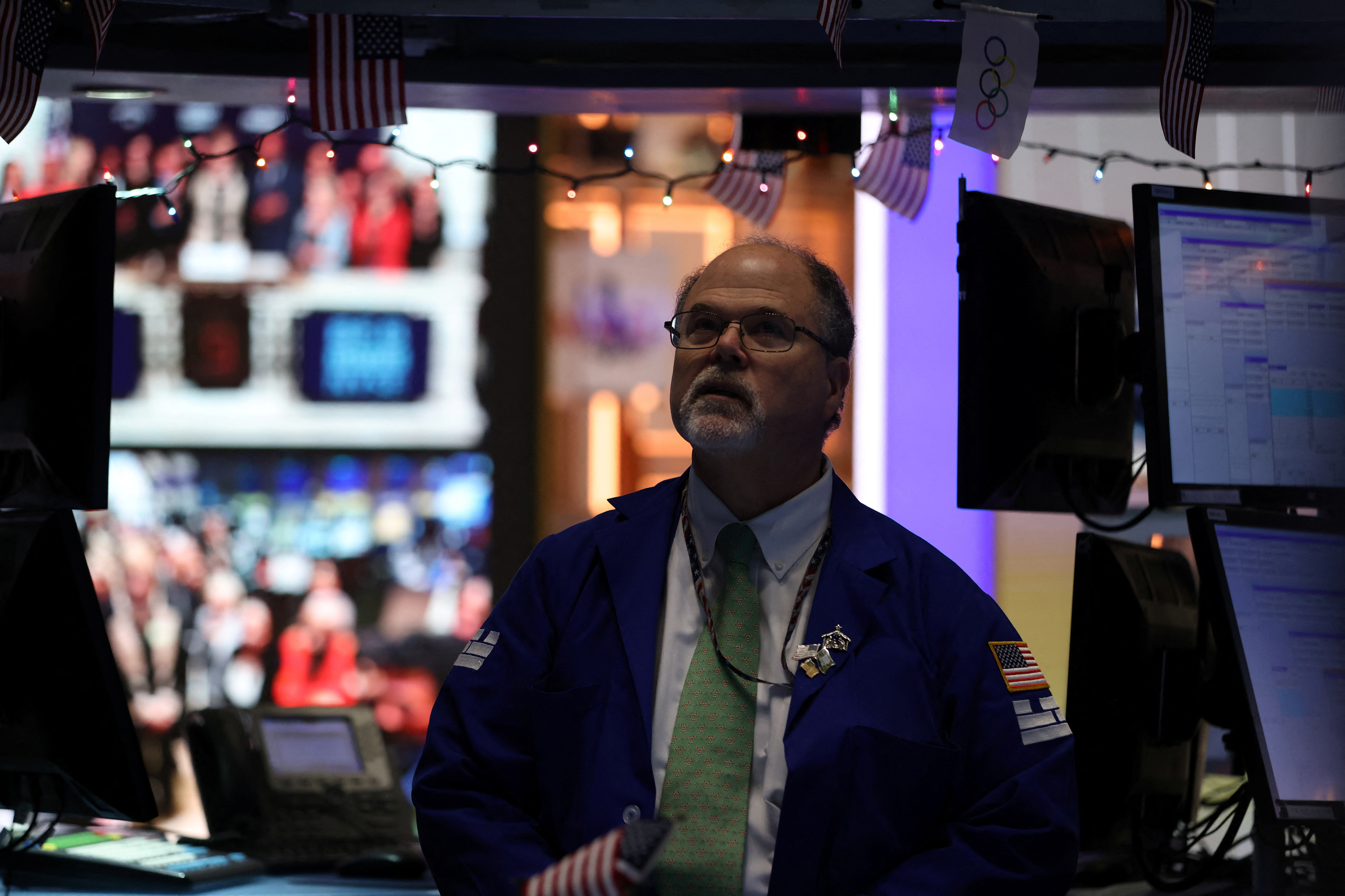 A trader works on the trading floor at the New York Stock Exchange (NYSE)  during the Federal Reserve announcement in New York City, U.S., December 14, 2022. REUTERS/Andrew Kelly