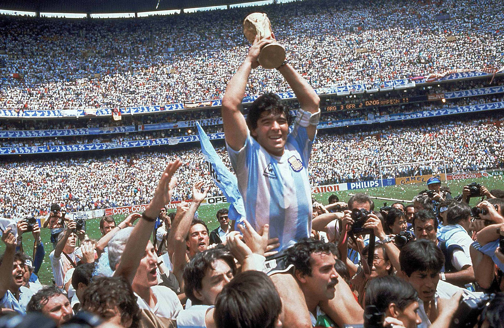 FILE - This is a June 29, 1986  file photo  of  Diego Maradona of Argentina celebrates with the cup at the end of the World Cup soccer final in the Atzeca Stadium, in Mexico City, Mexico. Argentina defeated West Germany 3-2 to take the trophy.   With one week to go before the World Cup starts in Brazil, The Associated Press takes a look at 10 great stars in the tournament's history. Maradona One the greatest playmakers of all time, Maradona was joint FIFA Player of the 20th Century with Pele. “El Pibe de Oro” inspired Argentina to victory in the 1986 tournament. The English will never forgive him for his “Hand of God” goal en route to winning the World Cup. And perhaps his own people, the Argentines, will never forgive him for being a terrible coach for the national team at the World Cup four years ago in South Africa. But as player, Maradona was peerless during his heyday, although drug problems marred the end of his career. (AP Photo/Carlo Fumagalli, File)
