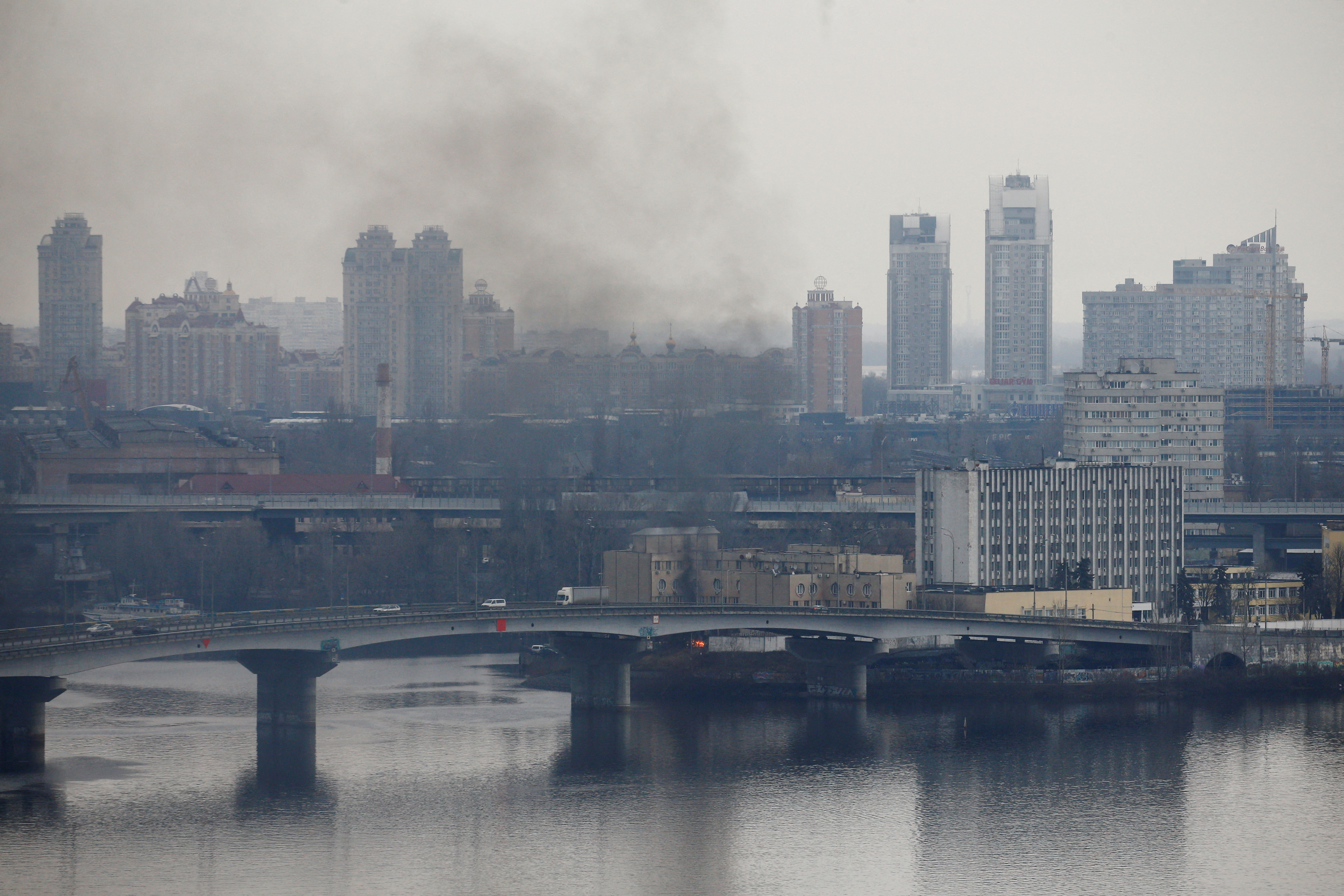 Smoke rises from the territory of the Ukrainian Defence Ministry's unit, after Russian President Vladimir Putin authorized a military operation in eastern Ukraine, in Kyiv, Ukraine February 24, 2022. REUTERS/Valentyn Ogirenko